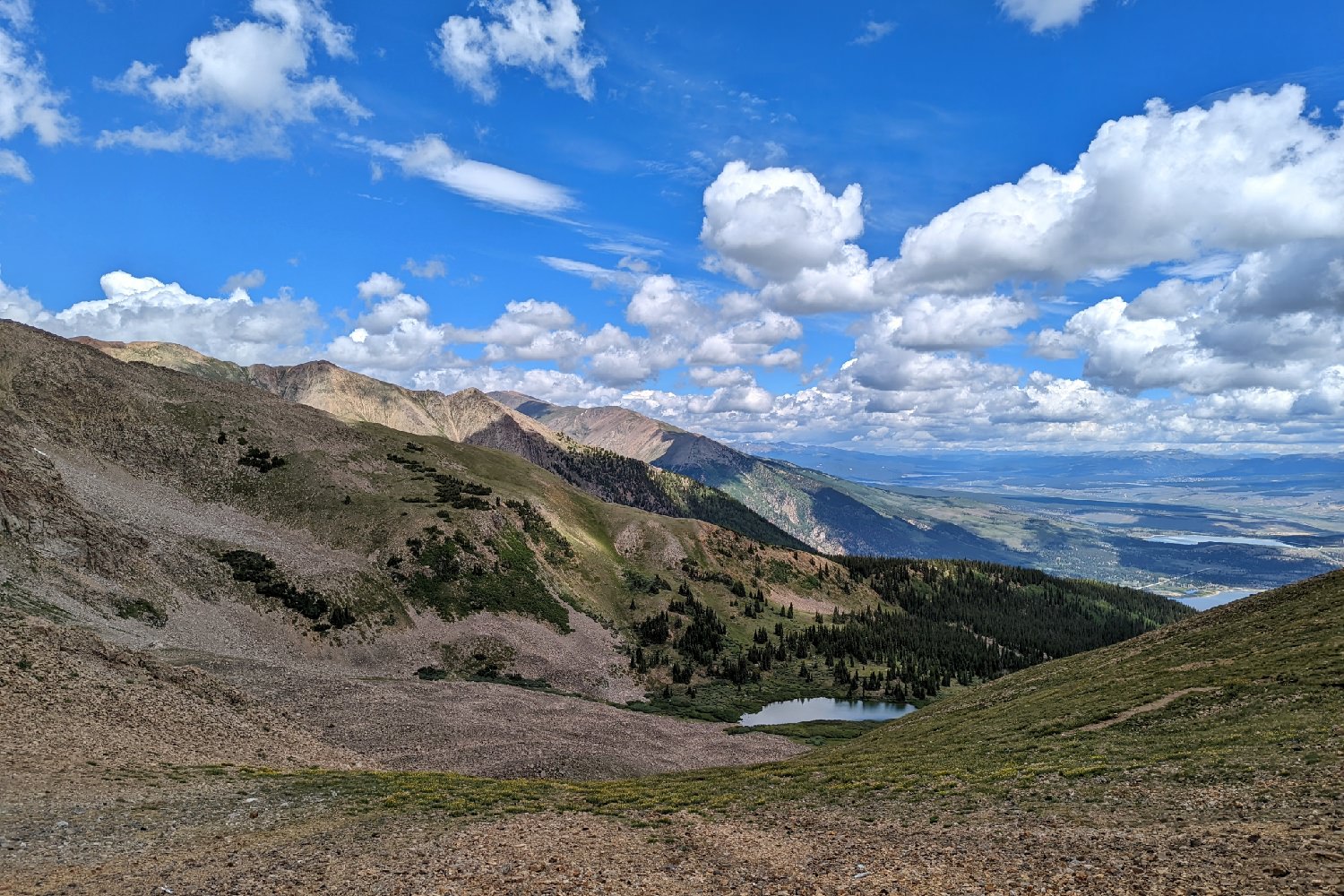 blue skies and white clouds over the collegiate peaks wilderness loop