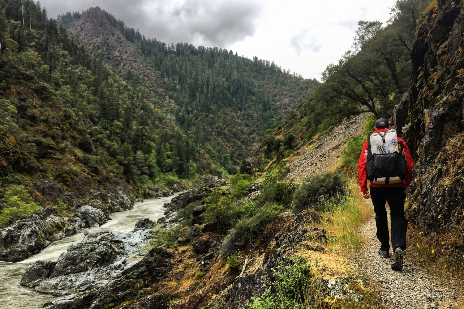 Backpacker on the Rogue River Trail above the Wild and Scenic whitewater section.