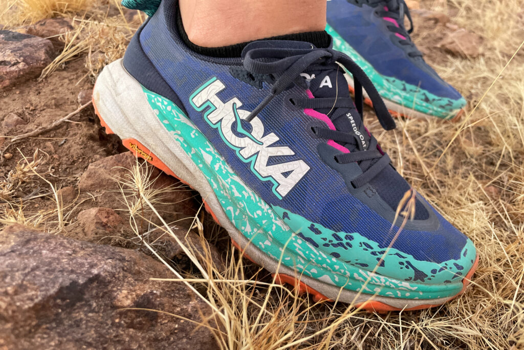 close up photo of a hiker wearing the hoka speedgoat 6