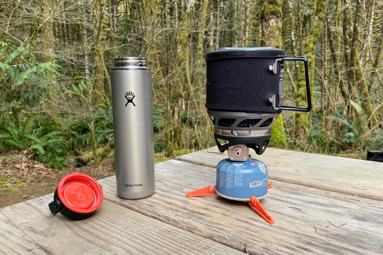 https://www.cleverhiker.com/wp-content/uploads/2020/05/Boiling-water-in-the-Jetboil-Minimo-Integrated-Canister-Stove-System-while-camping-in-the-Pacific-Northwest-to-make-hot-tea-in-the-Hydro-Flask-Lightwe.jpeg