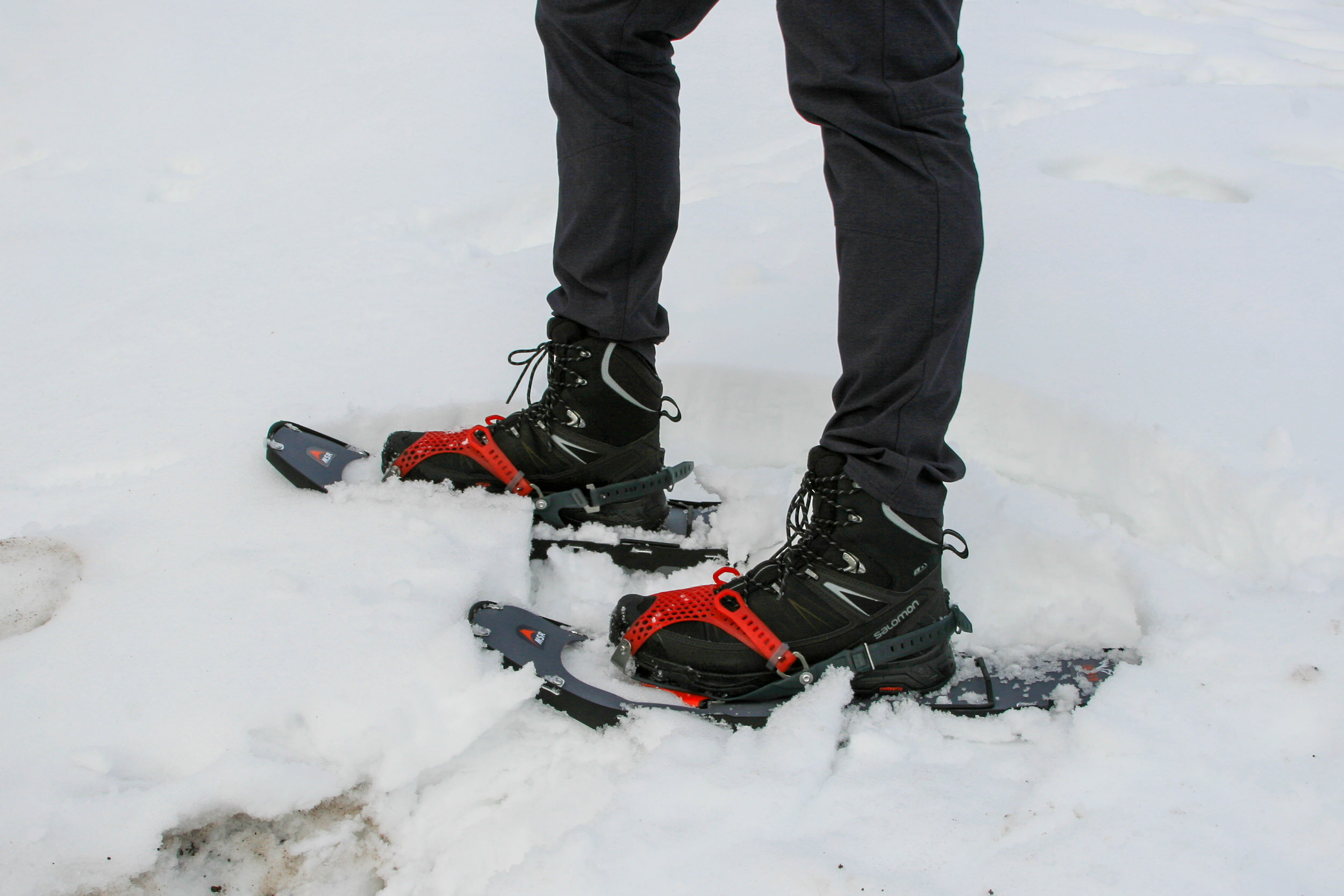 https://www.cleverhiker.com/wp-content/uploads/2023/08/A-hiker-wearing-Salomon-X-Ultra-Mid-Winter-CS-WP-Boots-with-snowshoes.jpeg