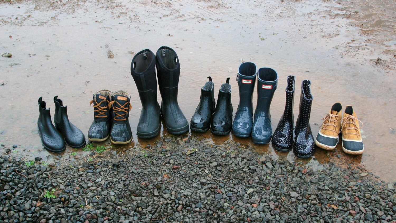 https://www.cleverhiker.com/wp-content/uploads/2023/08/A-variety-of-the-best-rain-boots-on-the-market-lined-up-for-comparison.jpeg