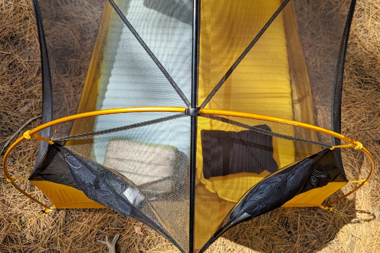 a top down view of a two person tent without a rainfly on so you can see their two sleeping pads and camp pillows