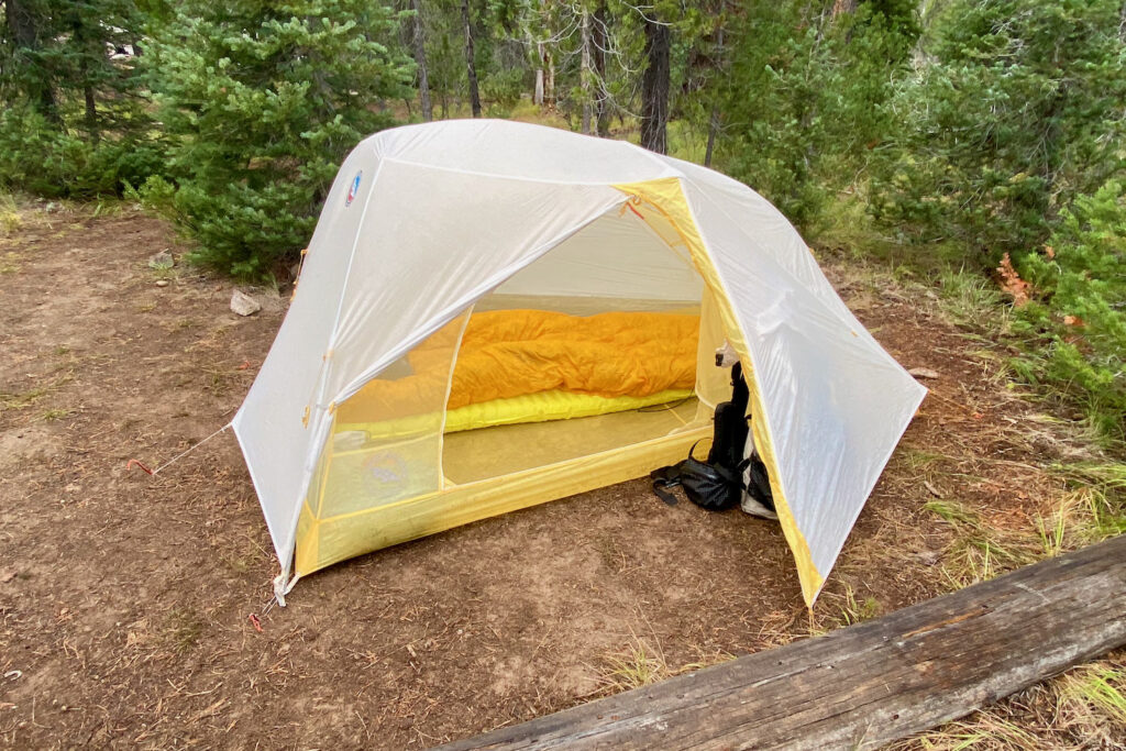 Close up of a tent with its rainfly door open. 