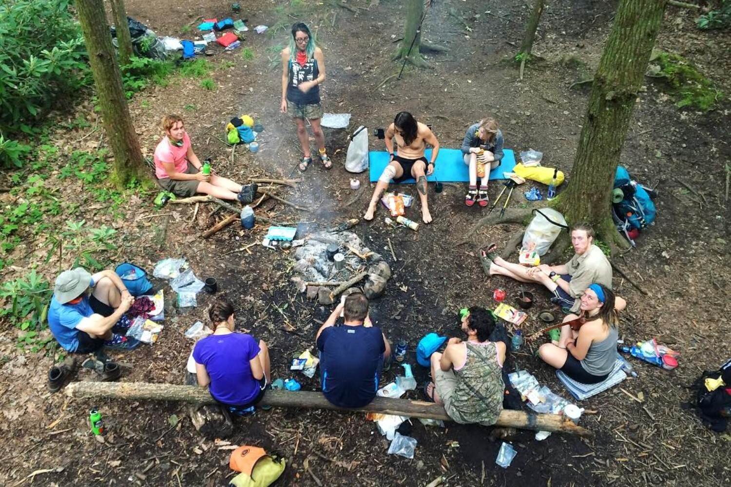 A group of thru-hikers on the AT around a campfire