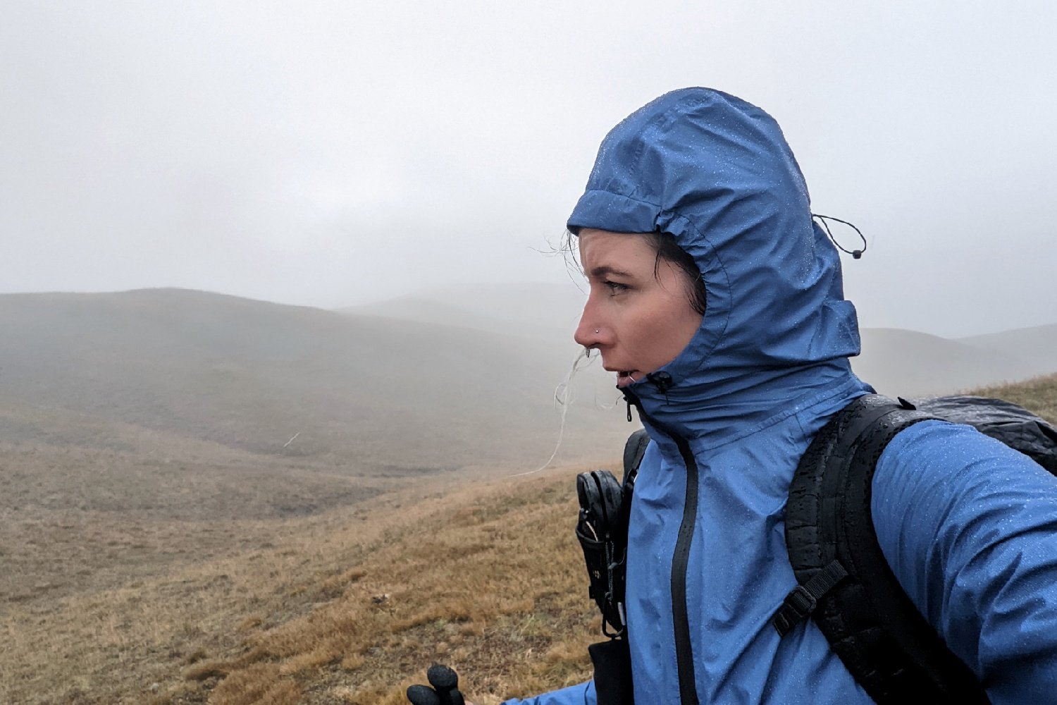 thru-hiker caught in the subalpine in the fog and rain with low visibility.