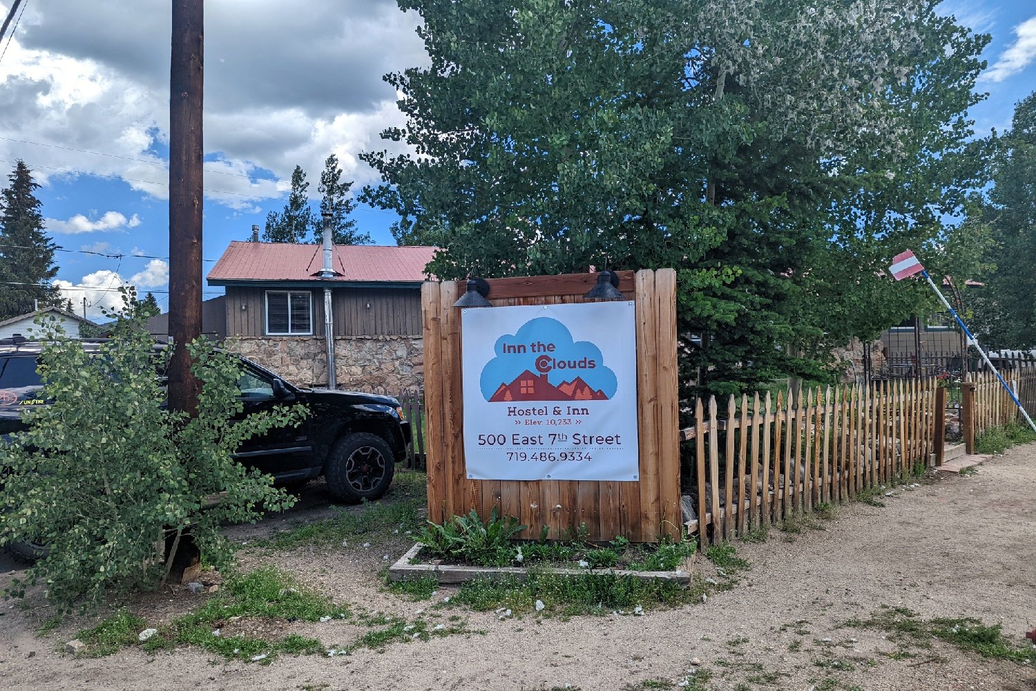 hostel sign that says inn the clouds hostel and inn 500 east 7th street. 10,765 elevation. 719-486-9334