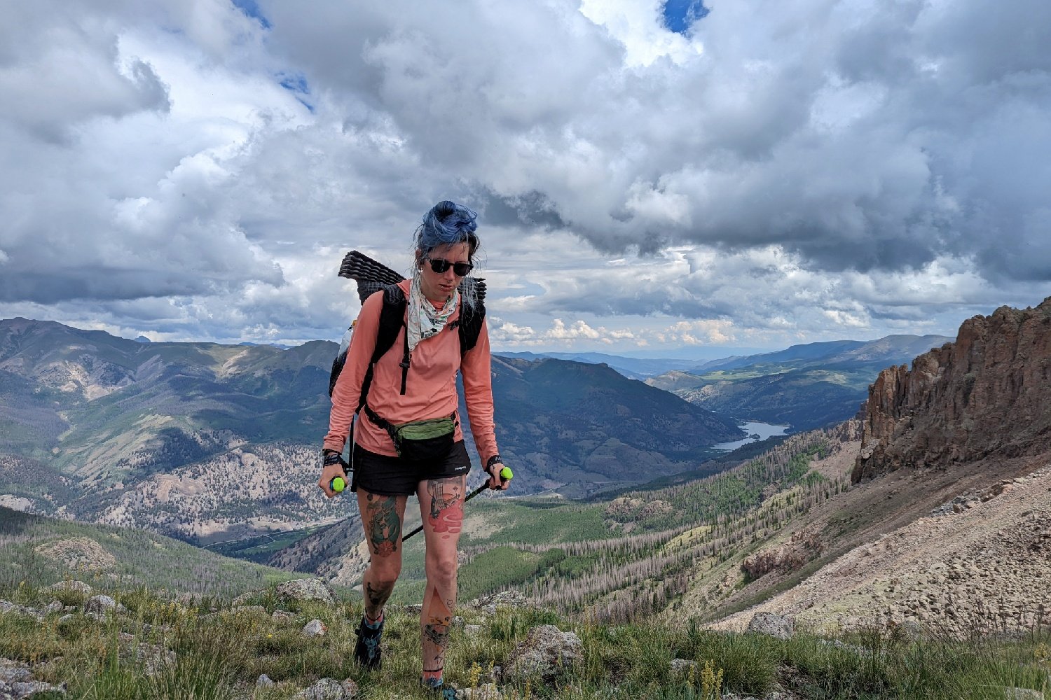 backpacker on the colorado trail with trekking poles