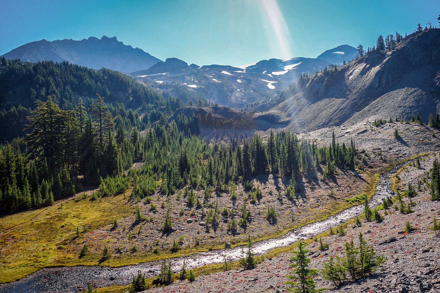 a creek flowing through lava fields in the three sisters wilderness