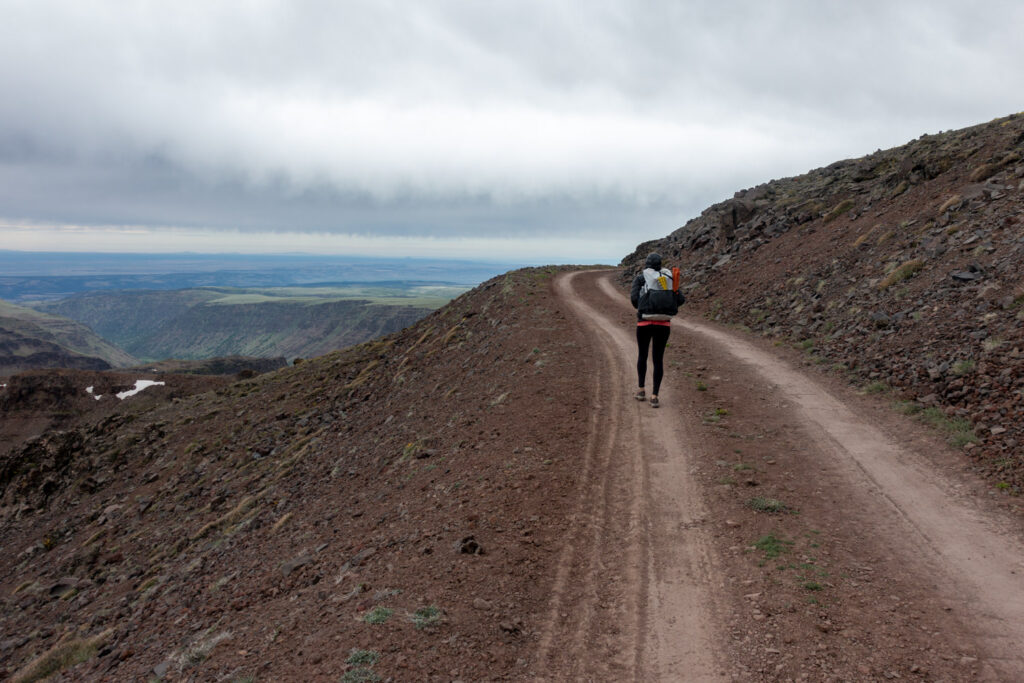 backpacker on steens mountain road in southeastern oregon