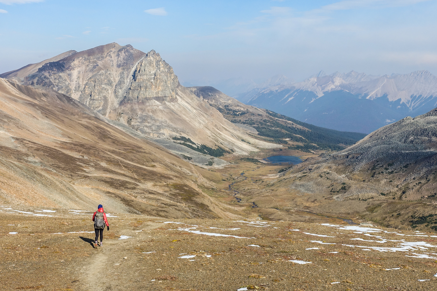 descending to a saddle with a lake on the skyline trail in jasper national park