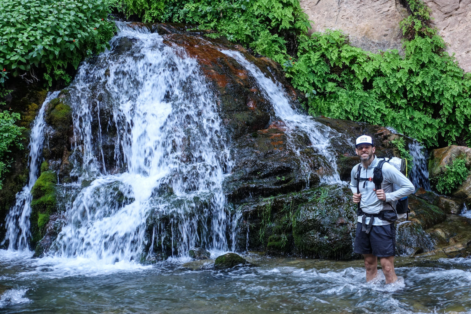 a hiker poses next to