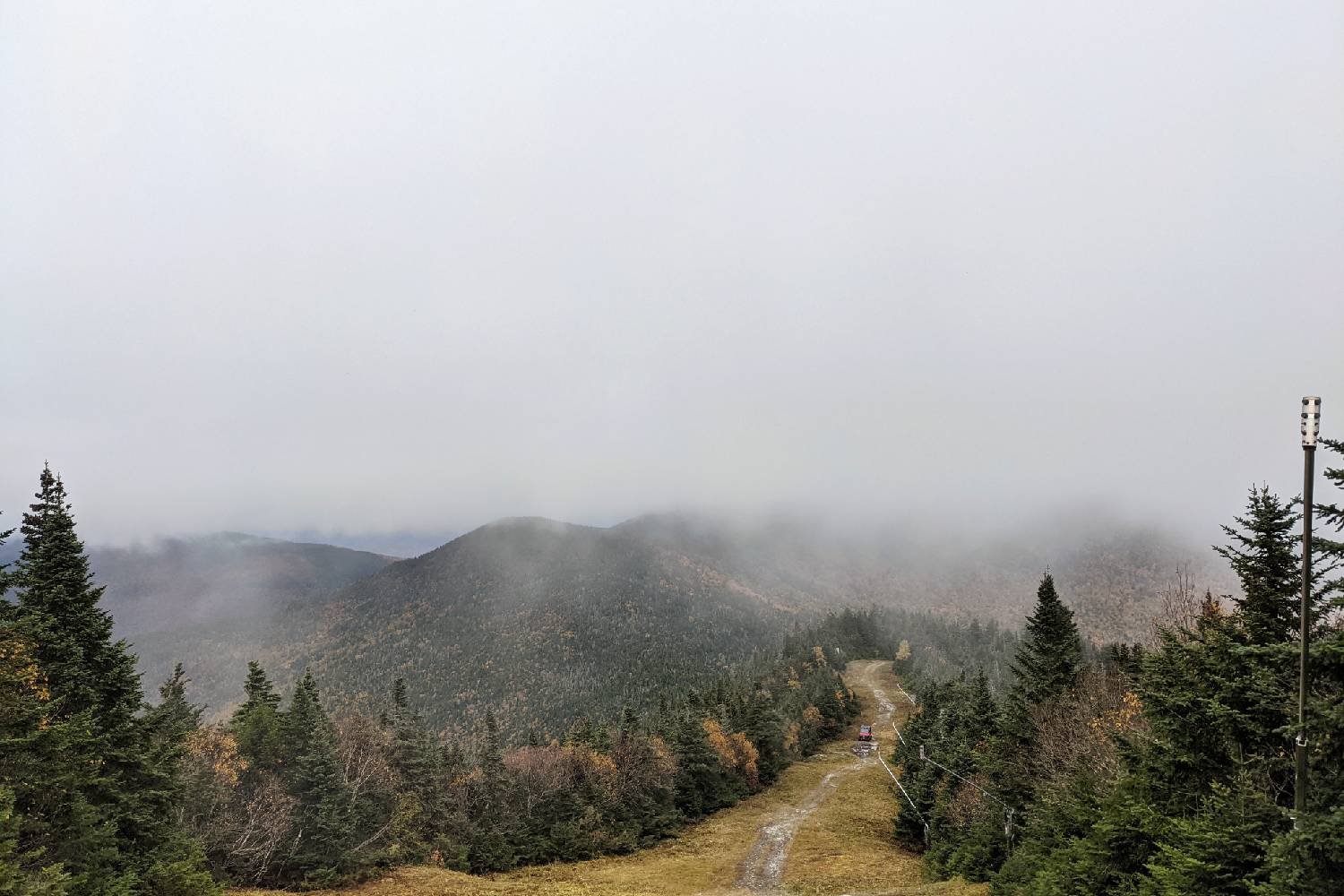 clouded peak on the long trail above a ski trail and chairlift in Vermont.