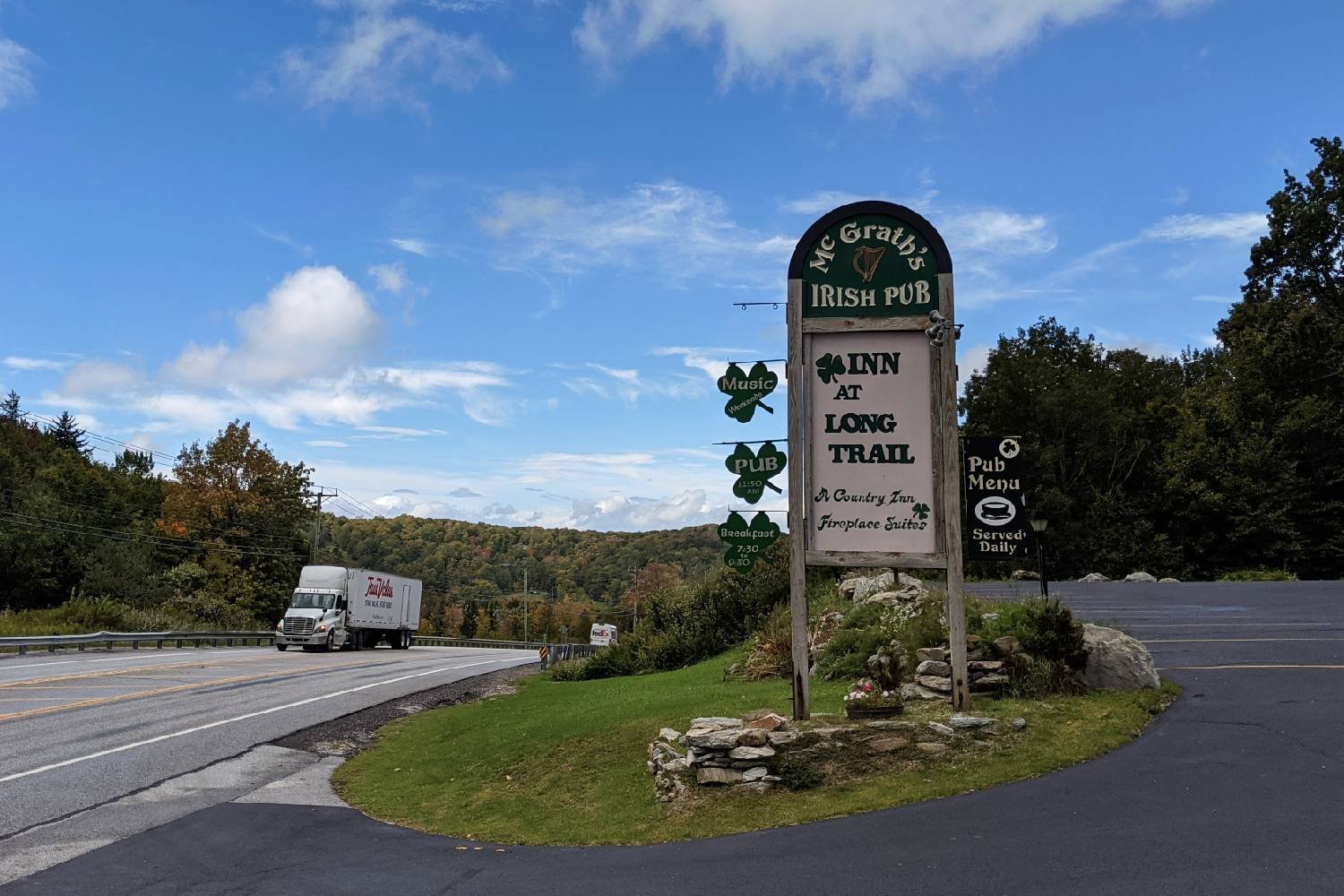 road side sign for the inn at the long trail in rutland, vermont.