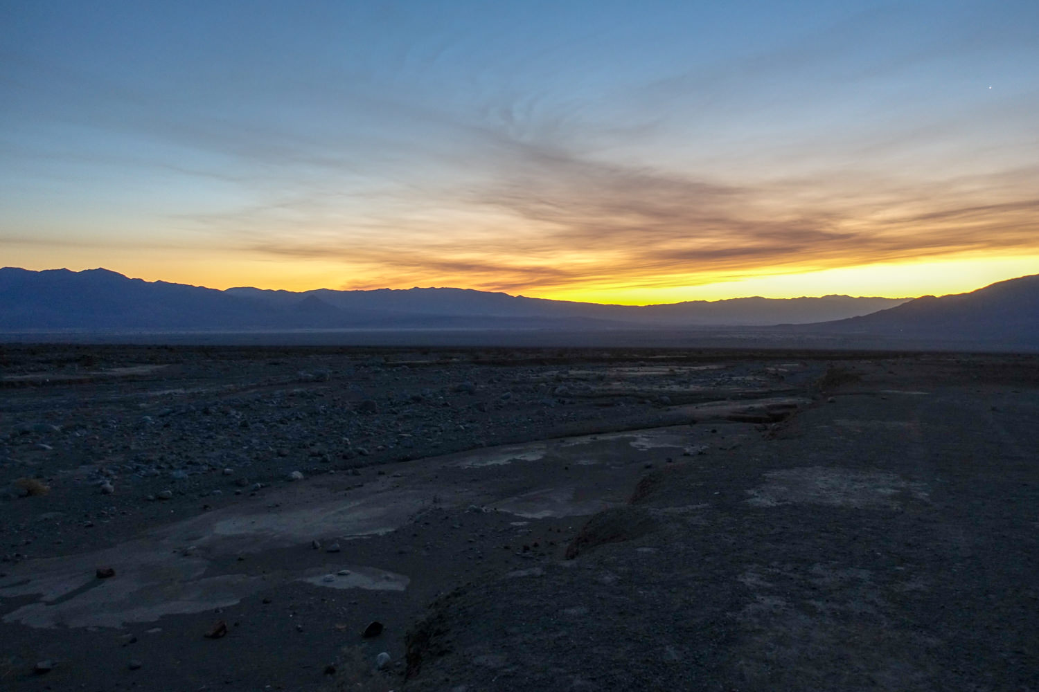 sunset on the flat desert of death valley