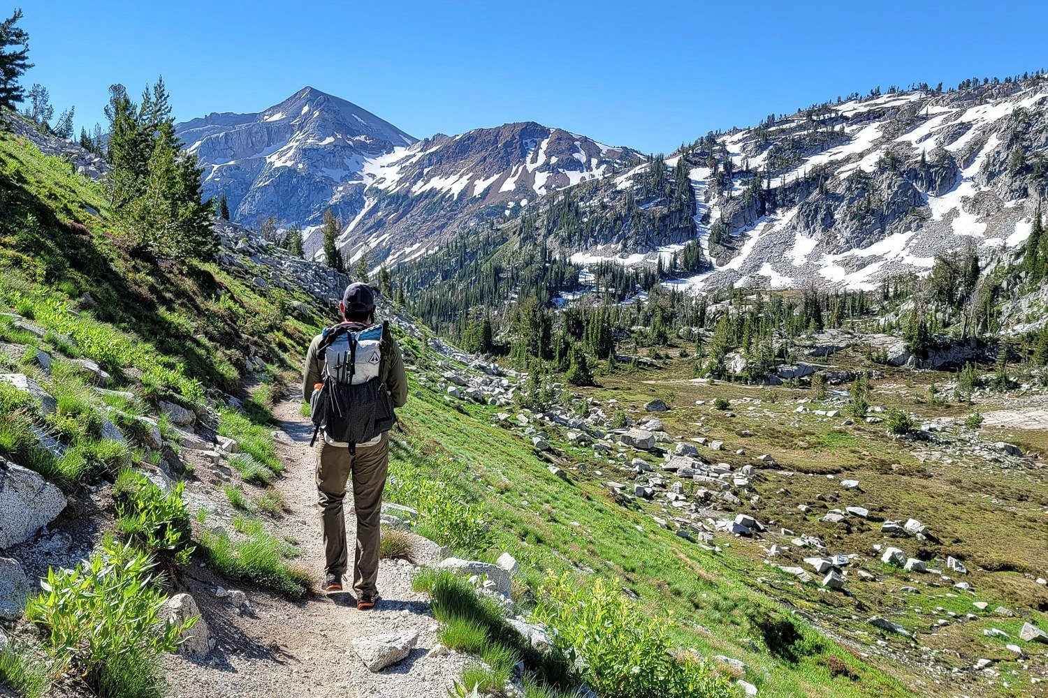 backpacker on the trail headed into the eagle cap wilderness in oregon.