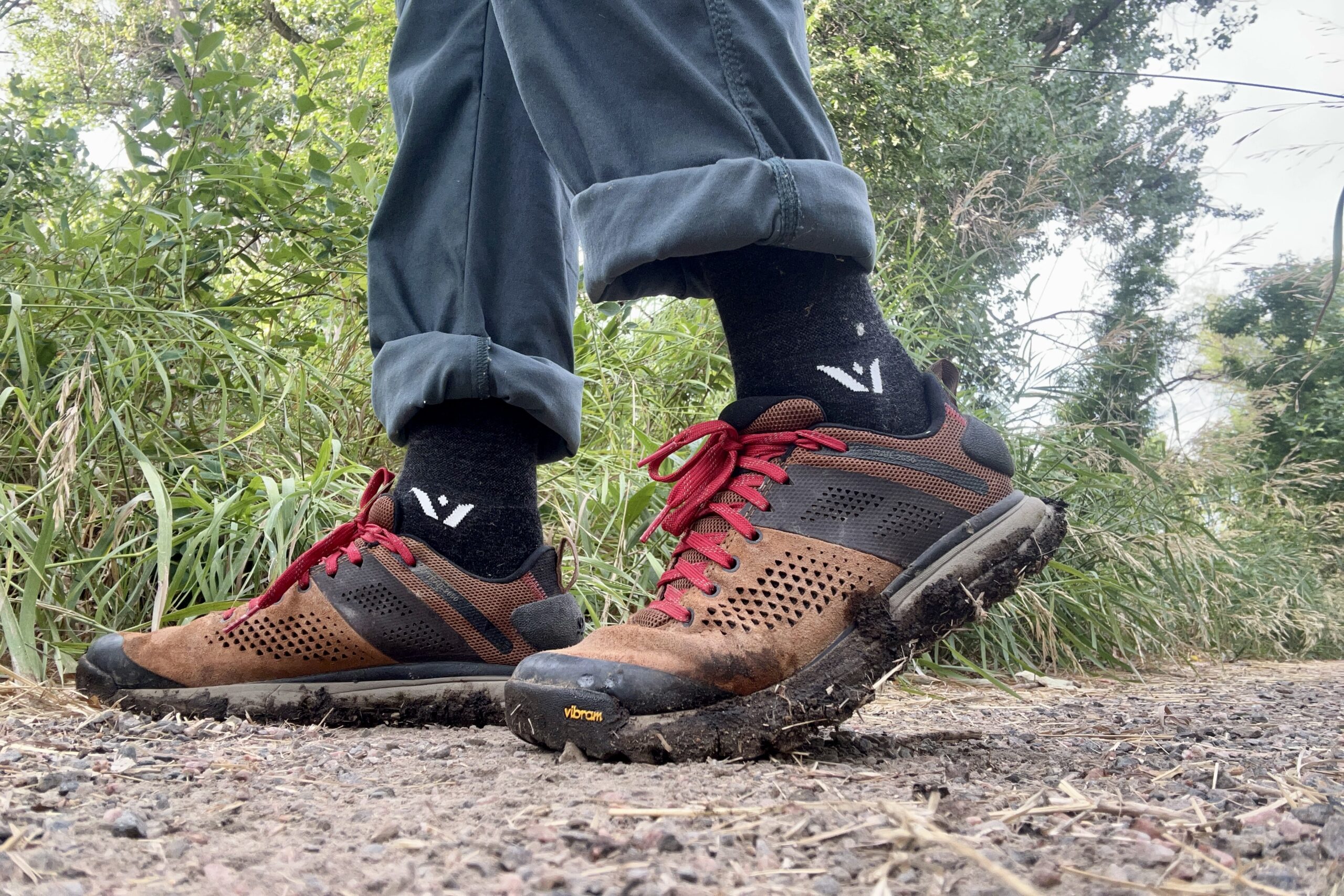 Close-up shot from the knees down of a man wearing the Danner Trail 2650 hiking shoes.