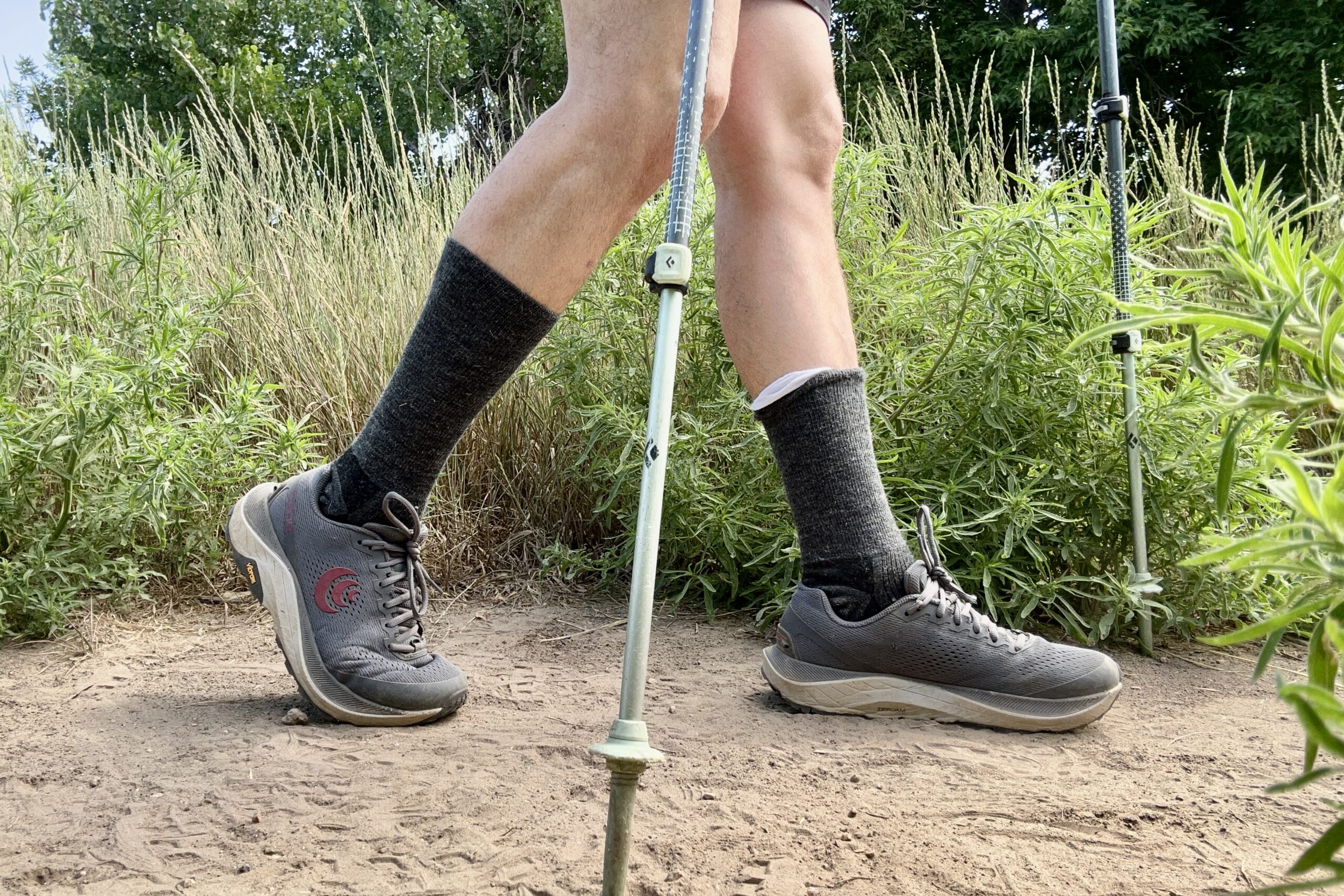 A close up shot of a man hiking in the men's Topo Athletic Ultraventure 3 shoes.