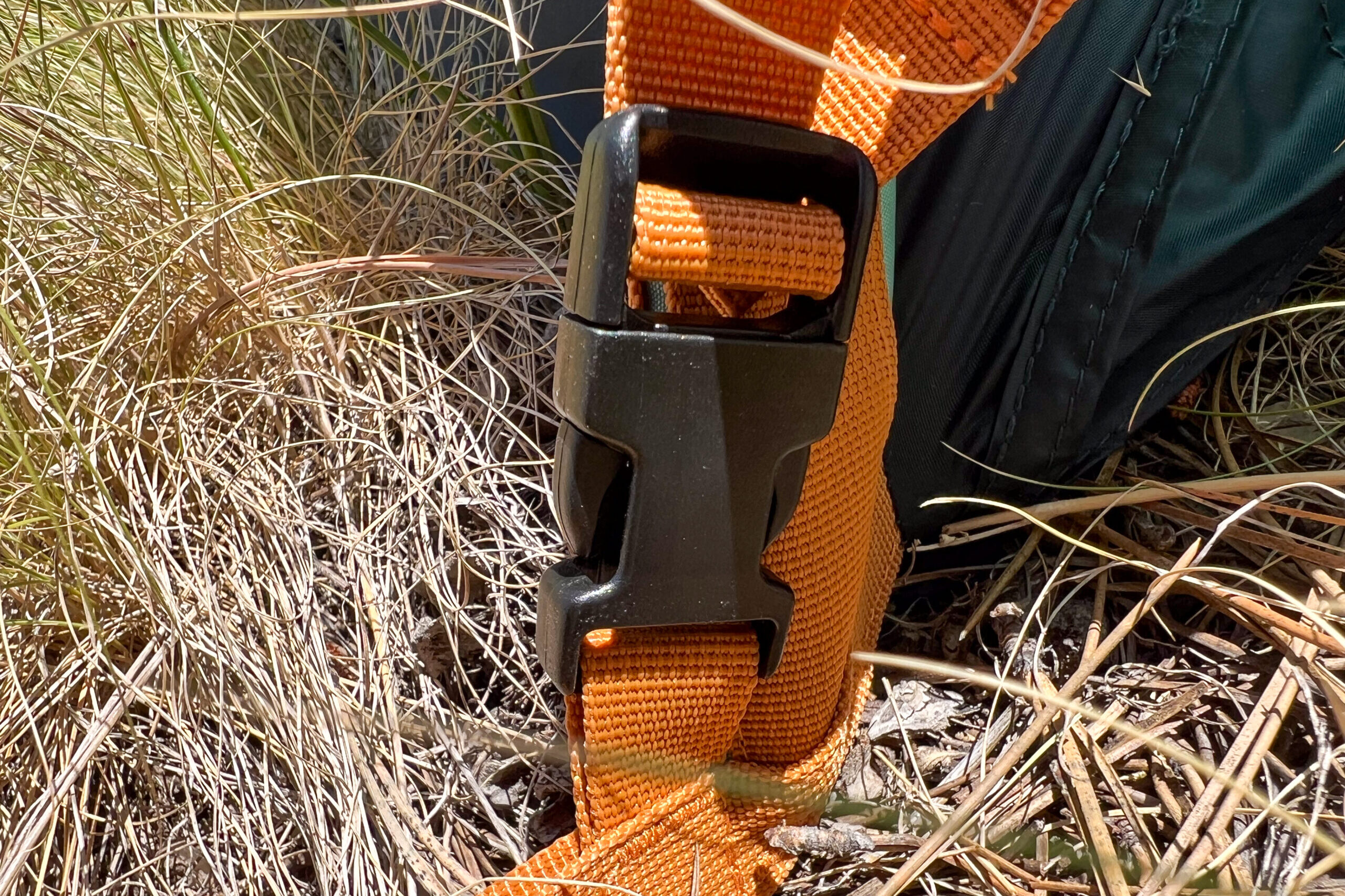 The image shows the orange color coded webbing that allows the rainfly to be easily oriented.