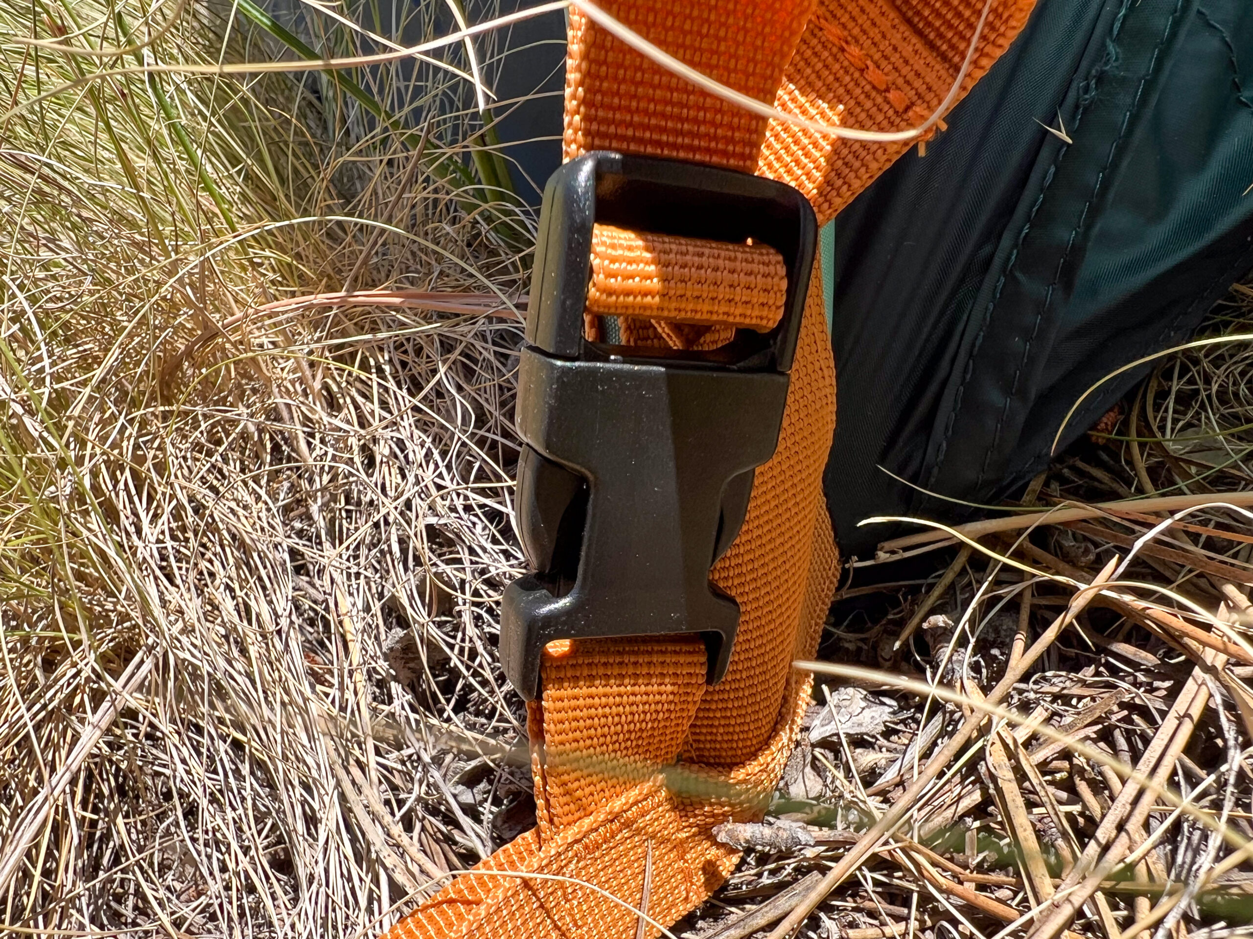 The image shows the orange color coded webbing that allows the rainfly to be easily oriented.