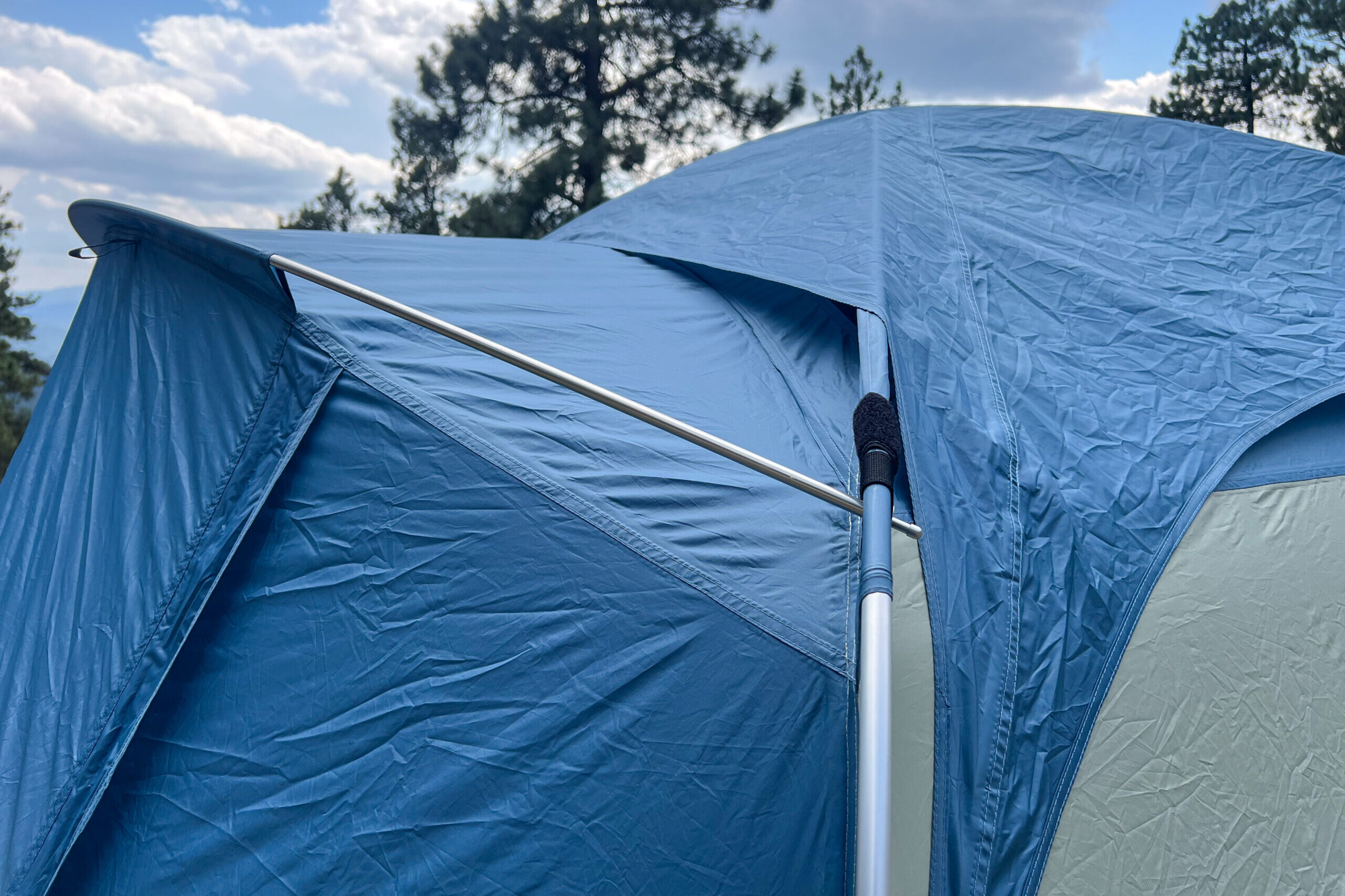 The image shows the rainfly of the REI Skyward 4 being a bit askew when deployed on the tent.