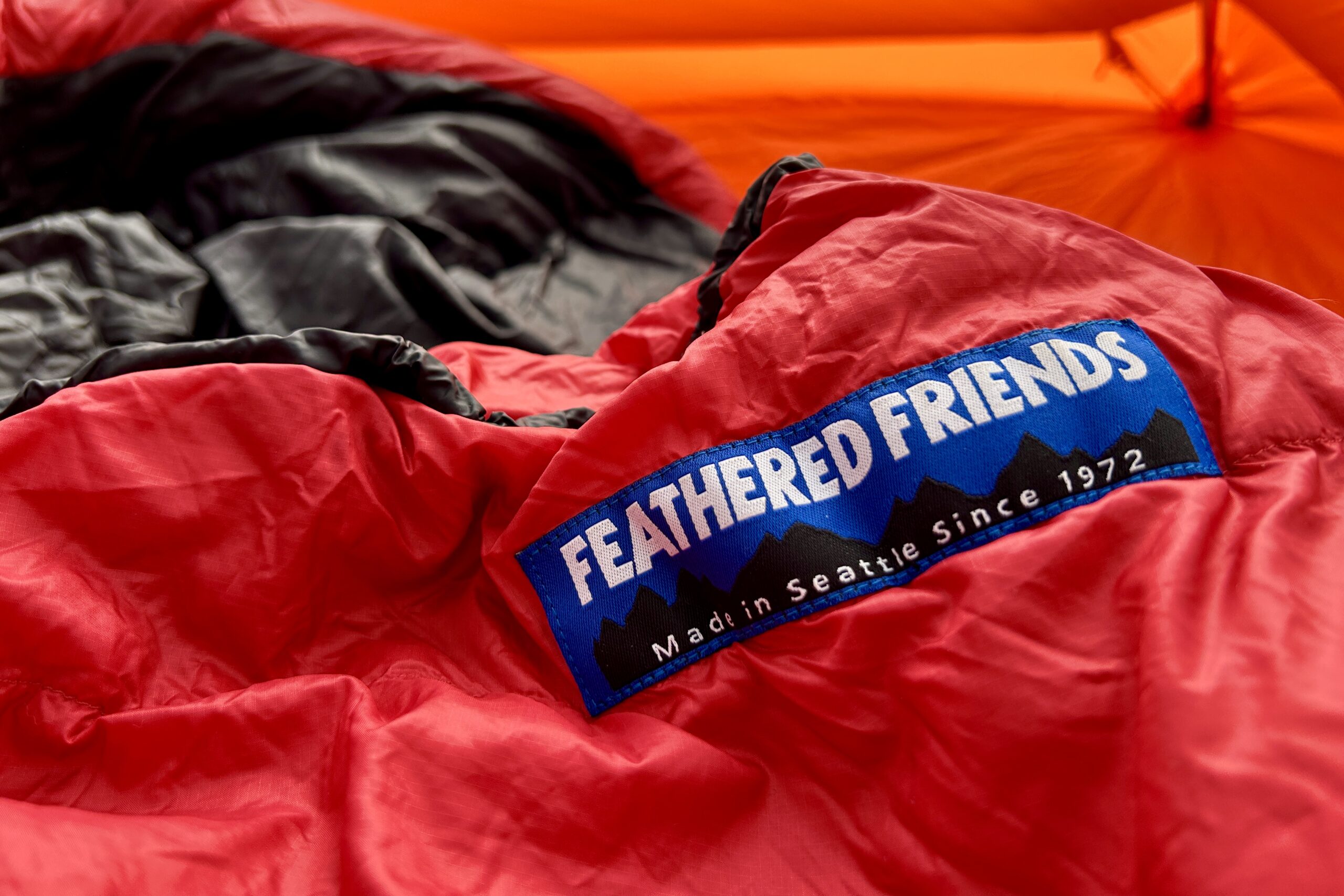 A close up image of the Feathered Friends logo sewn on a sleeping bag.