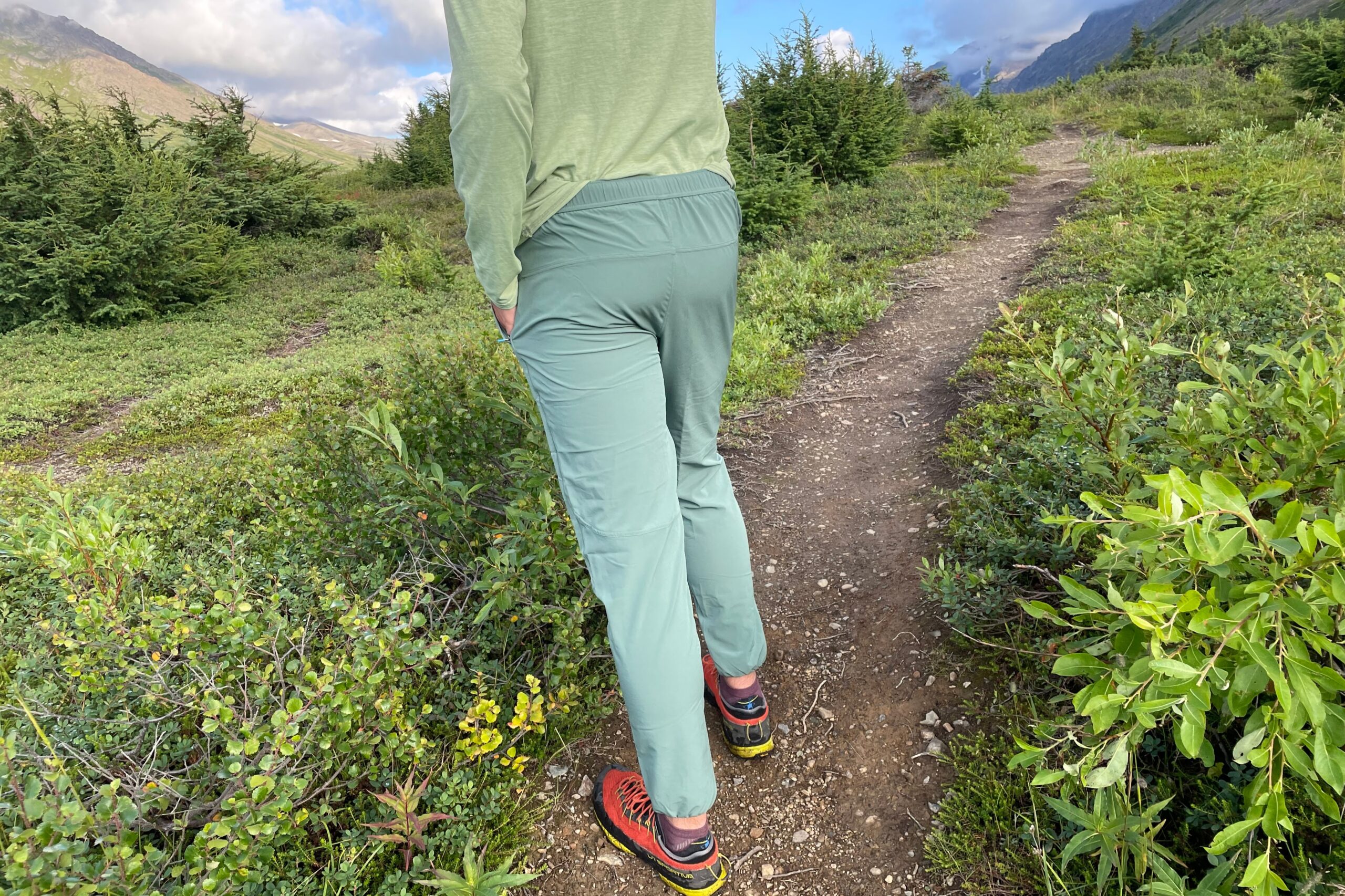 A from behind shot of hiking pants on an alpine trail.