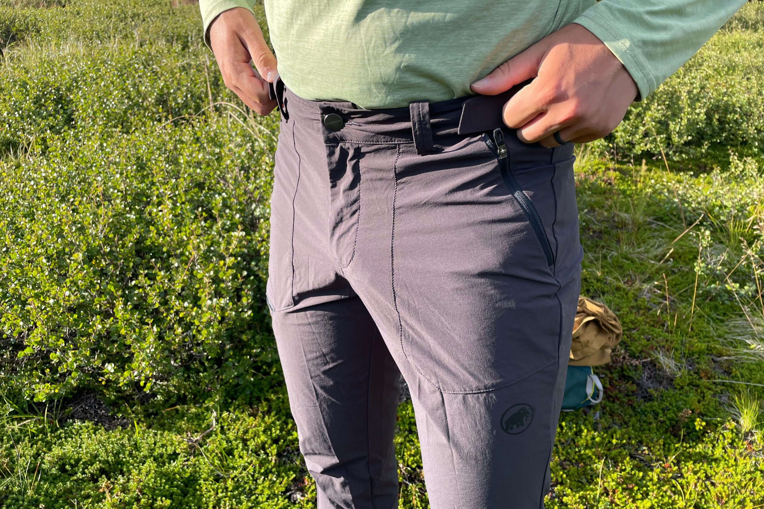 A closeup of the waist of hiking pants.