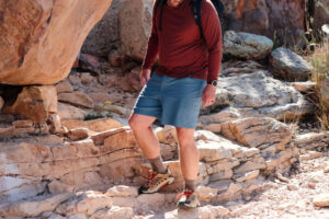 Man hiking down a rocky trail.