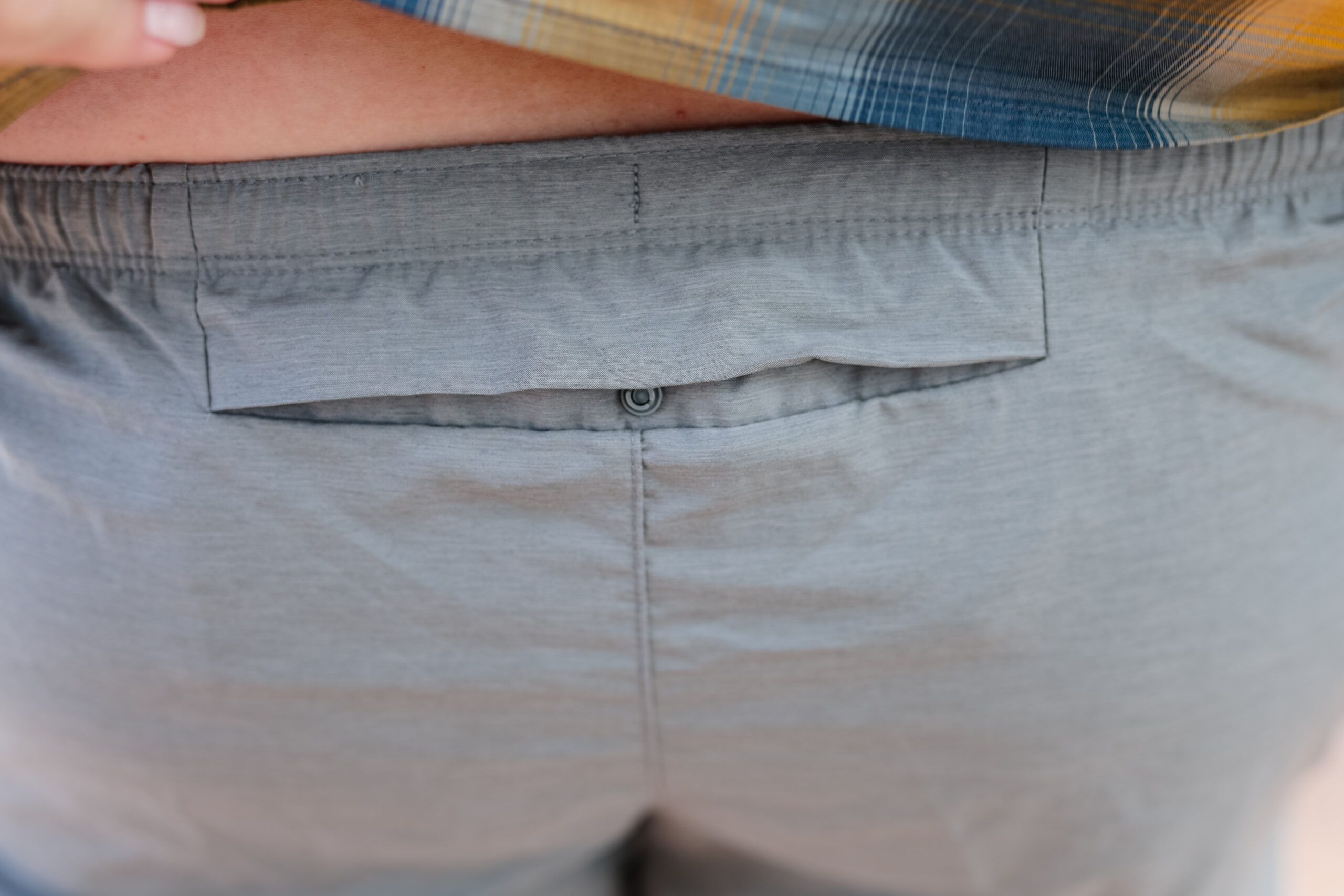 Close up of back pocket on hiking shorts.