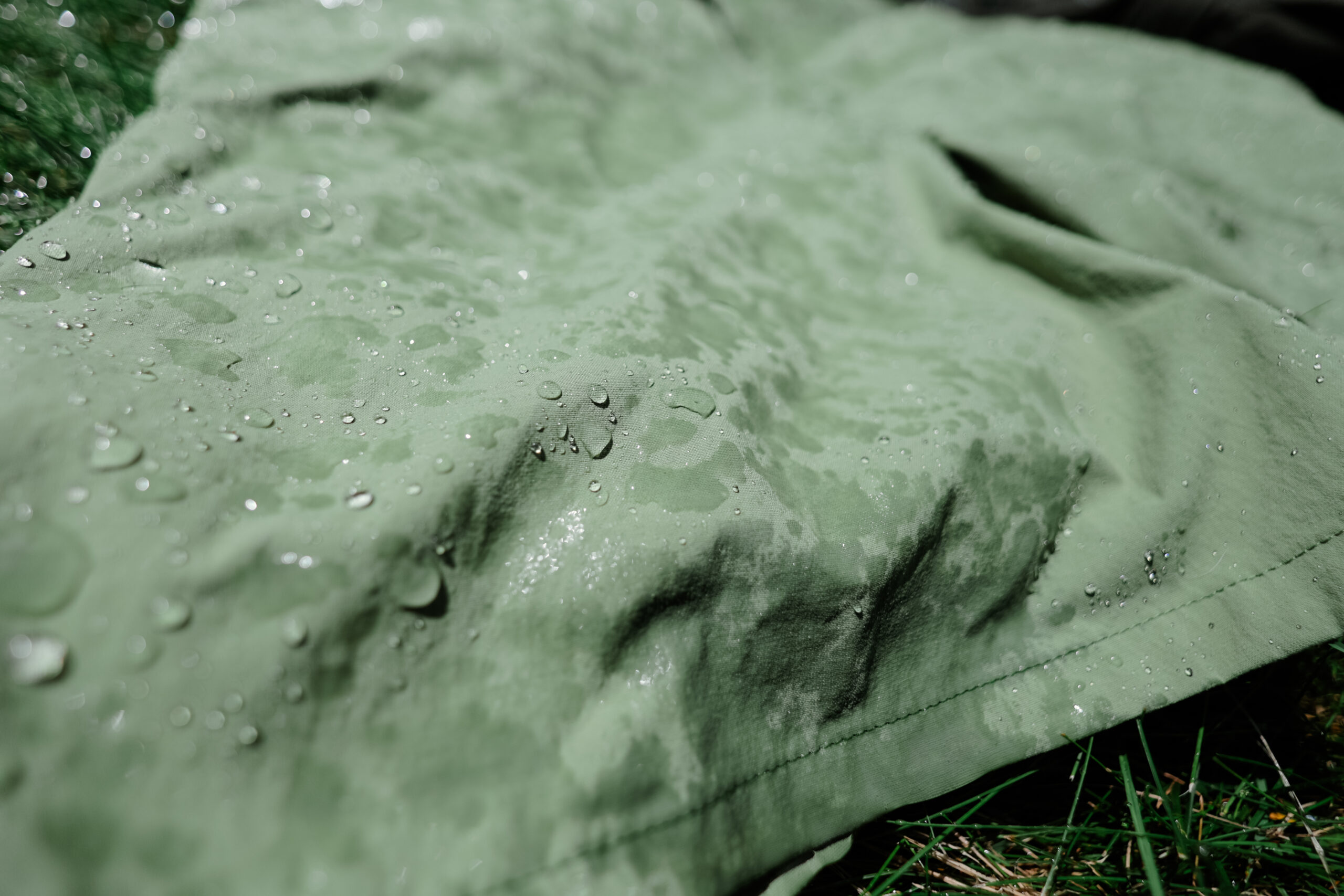 Close up of water beads on hiking shorts.