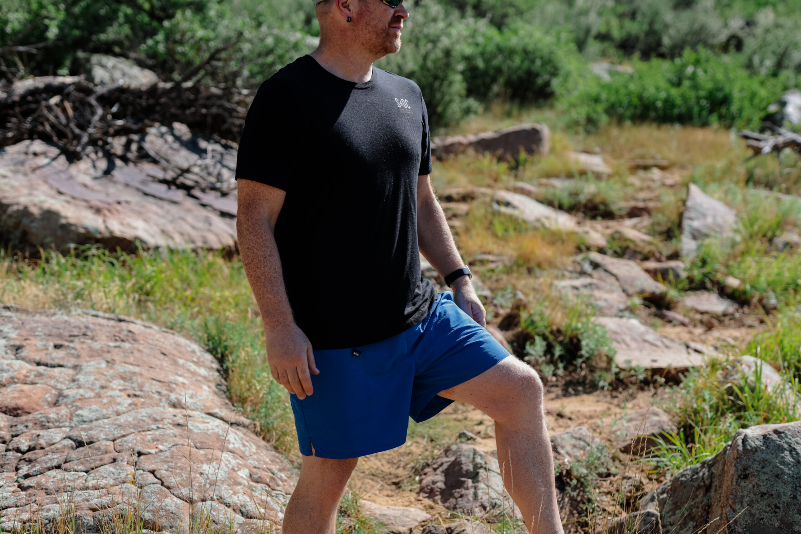 Close up of shorts on a man on a rock.