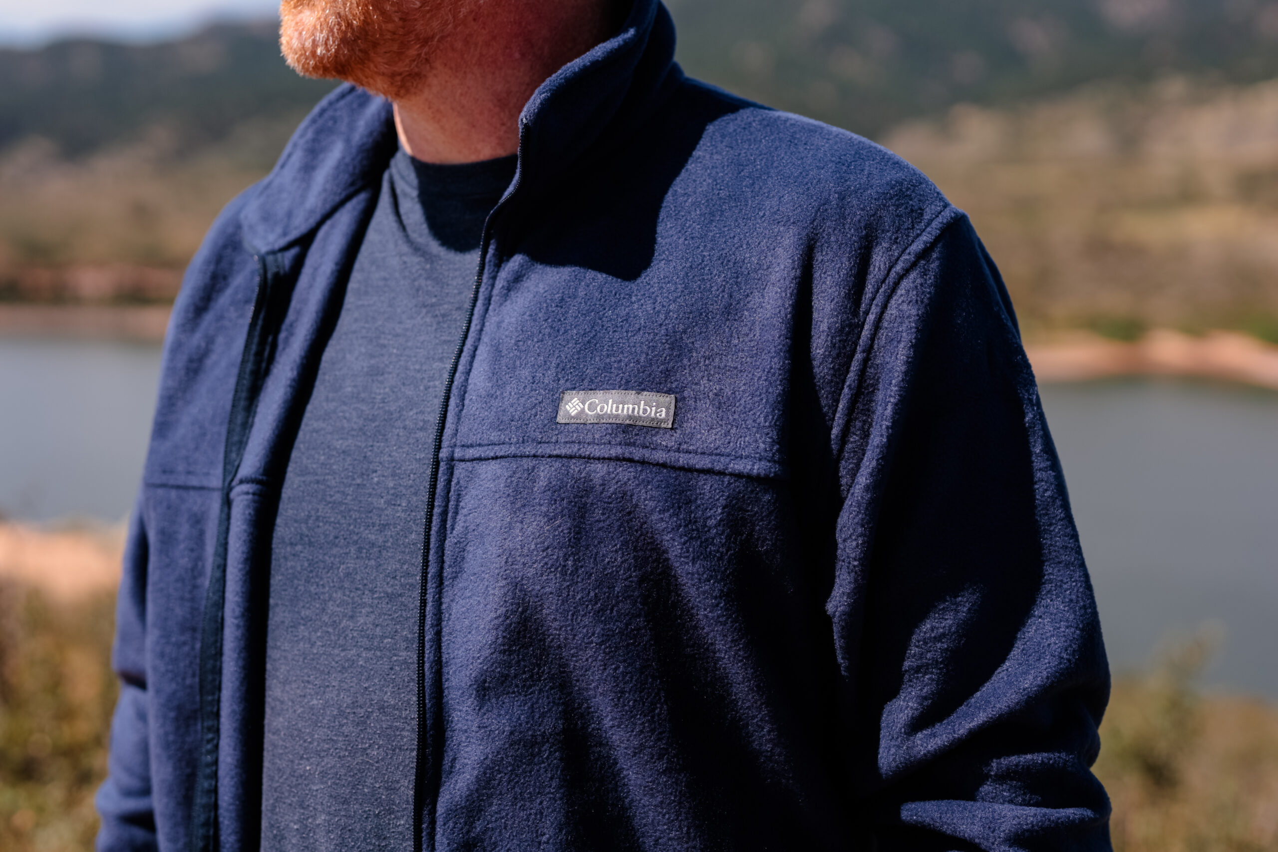 A close up of the logo on a blue fleece.