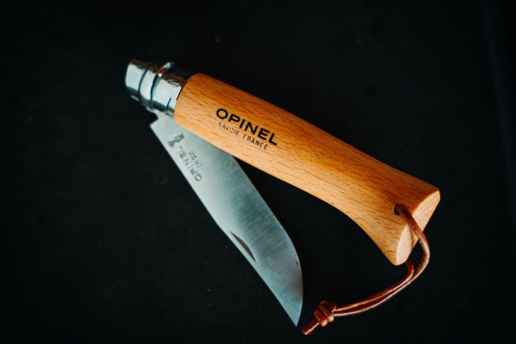 Product photo of the Opinel No. 8 pocket knife partially opened to show the blade