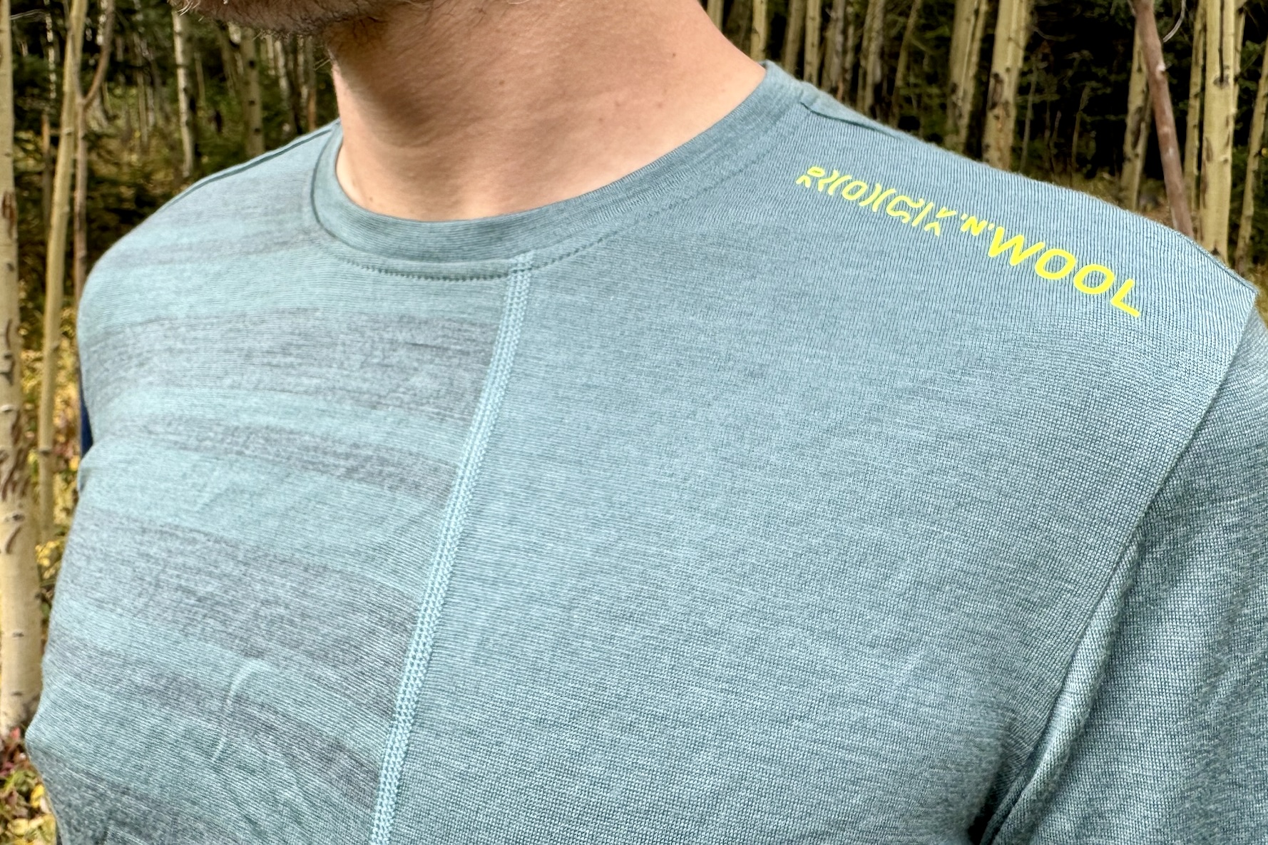 A close up of the crew neck on the Rock'n'Wool base layer worn on a hiker.