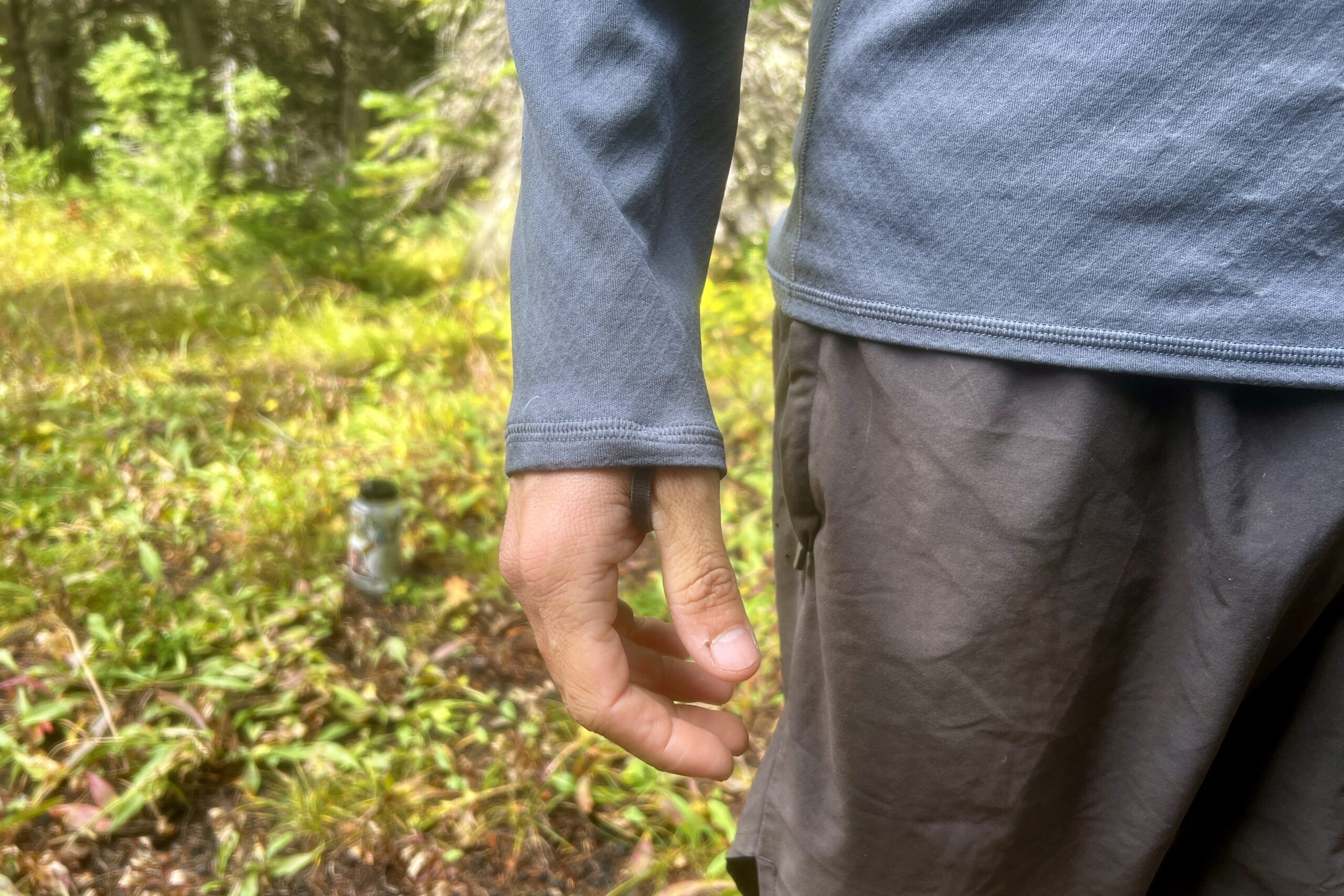 A close up of the wrists on the Patagonia Capilene. Trees are in the background.