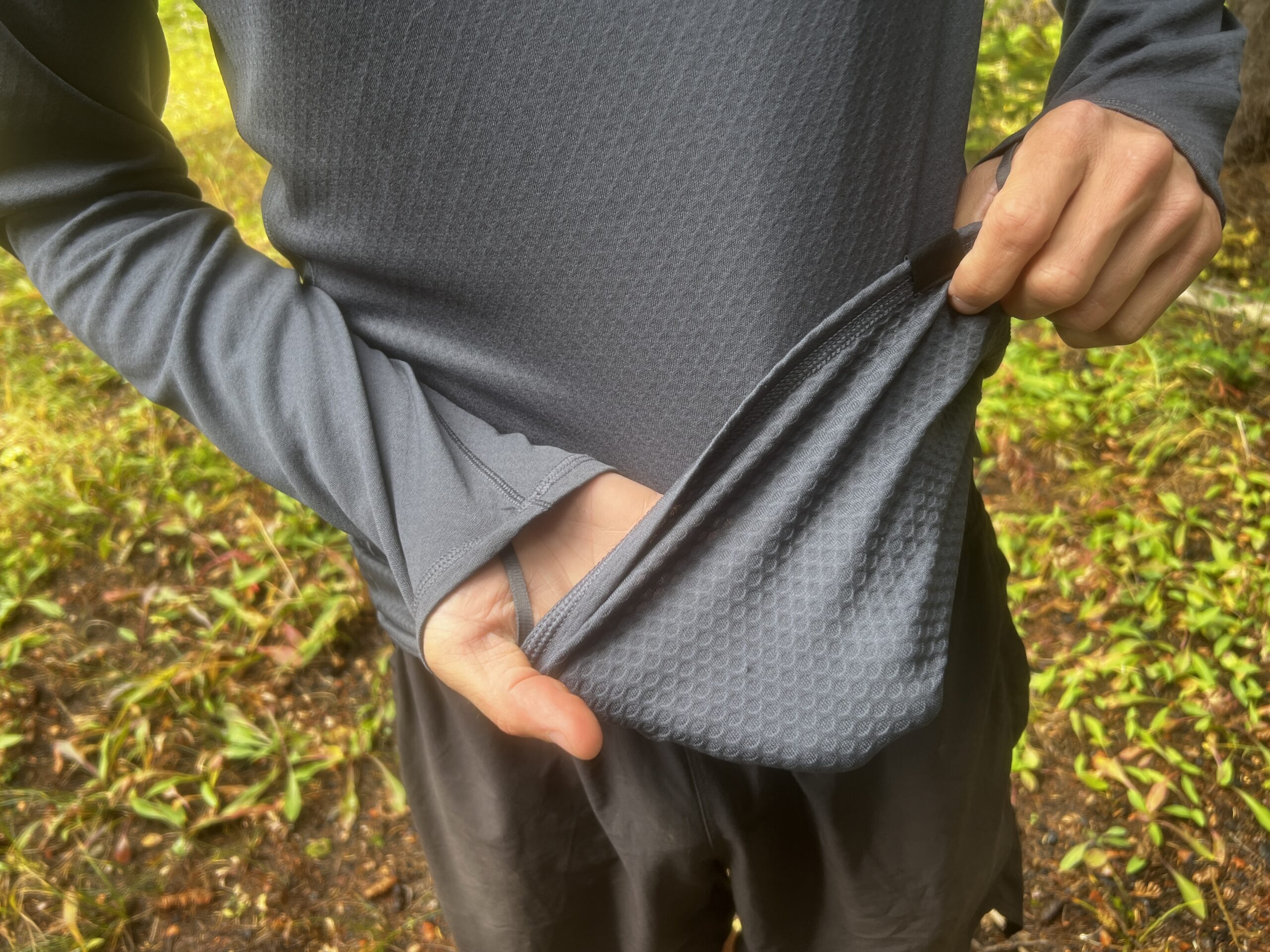 A hiker showing the waffled texture of the Patagonia Capilene.