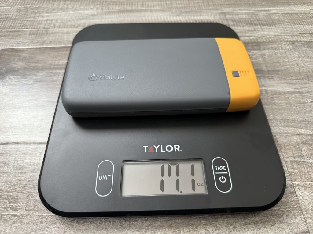 Close up of the BioLite power bank sitting on a kitchen scale.