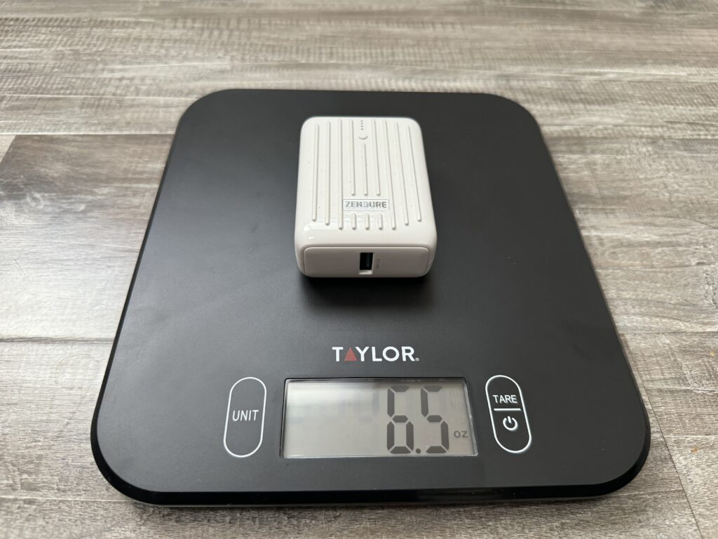 Close up of the Zendure power bank sitting on a kitchen scale.