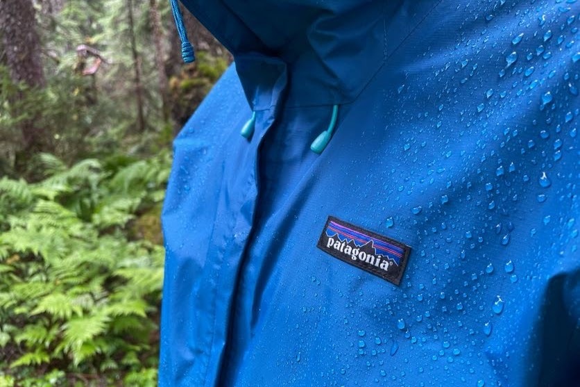 A closeup of the logo of a rain jacket