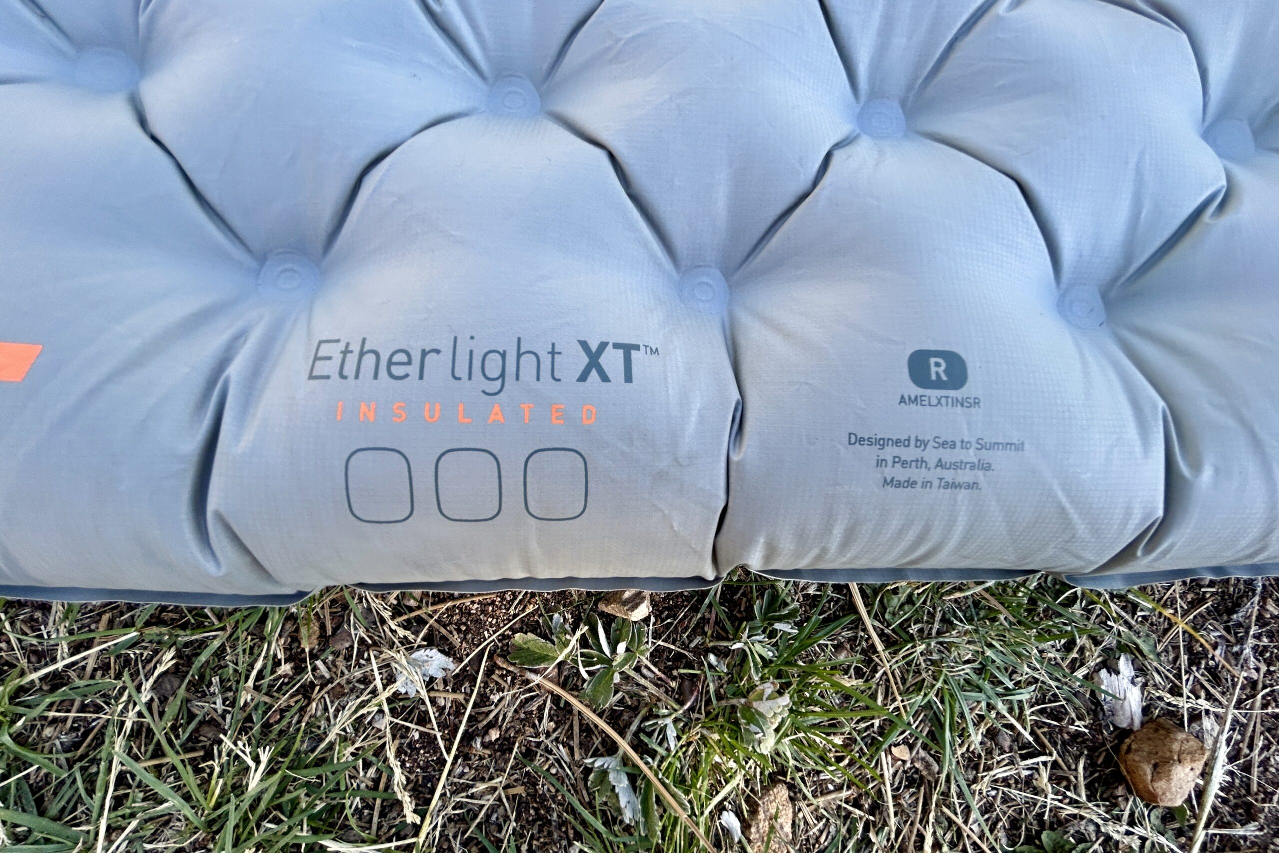 Close up image of a sleeping pad at the edge of the pad.