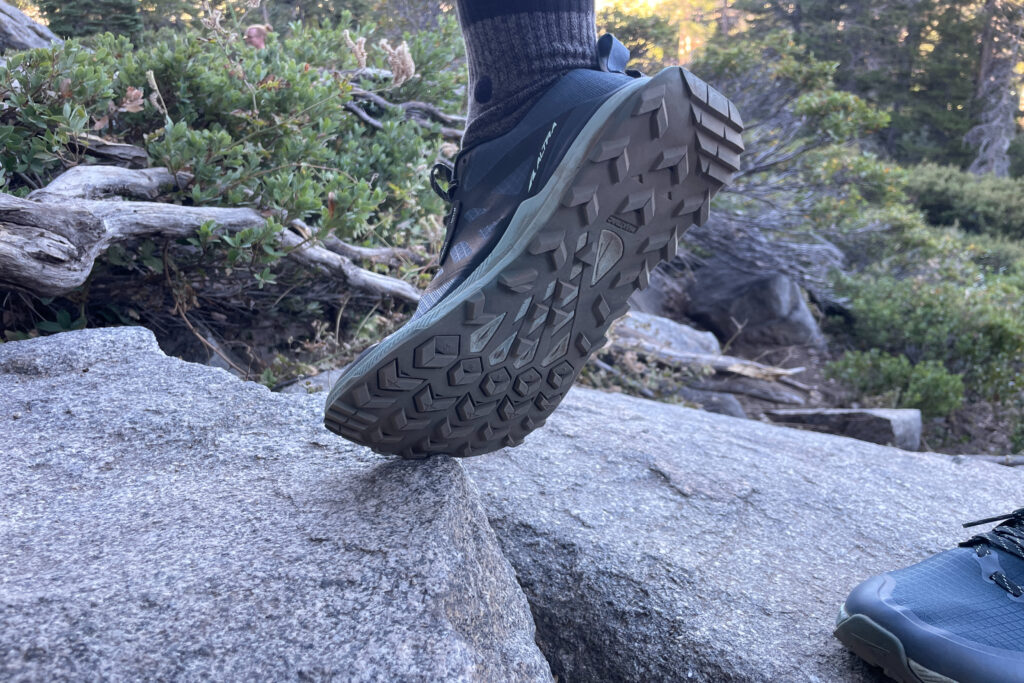 the lug pattern and sole of an altra lone peak 8 womens trail running shoe