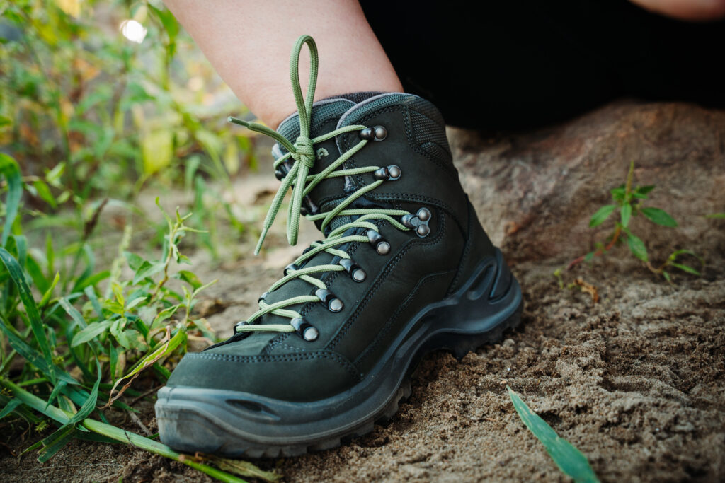 Hiker resting on the trail in her Lowa Renegade GTX Women's Hiking Boots