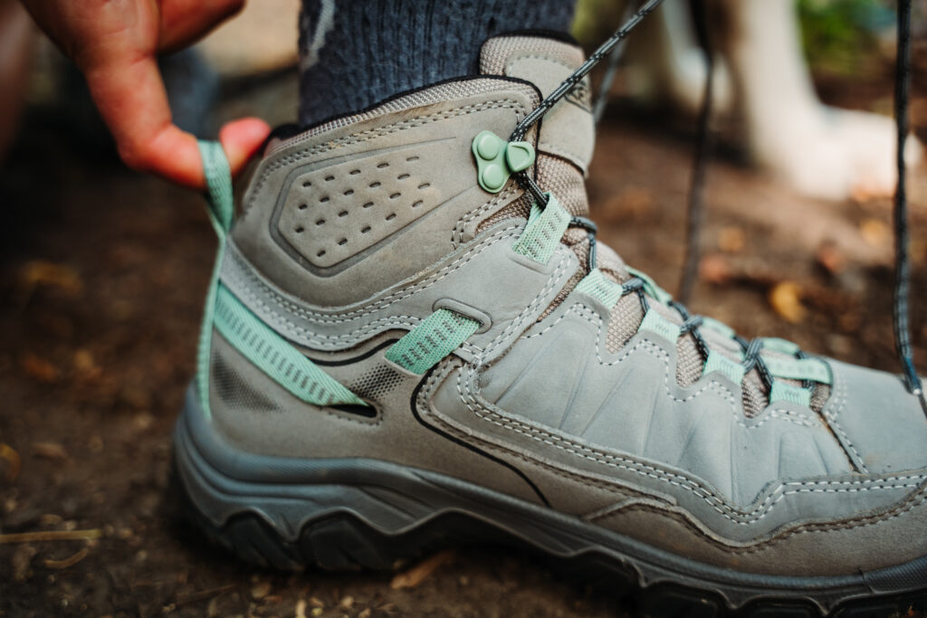 Hiker showing the securing strap on the heel of the Women’s KEEN Targhee IV WP