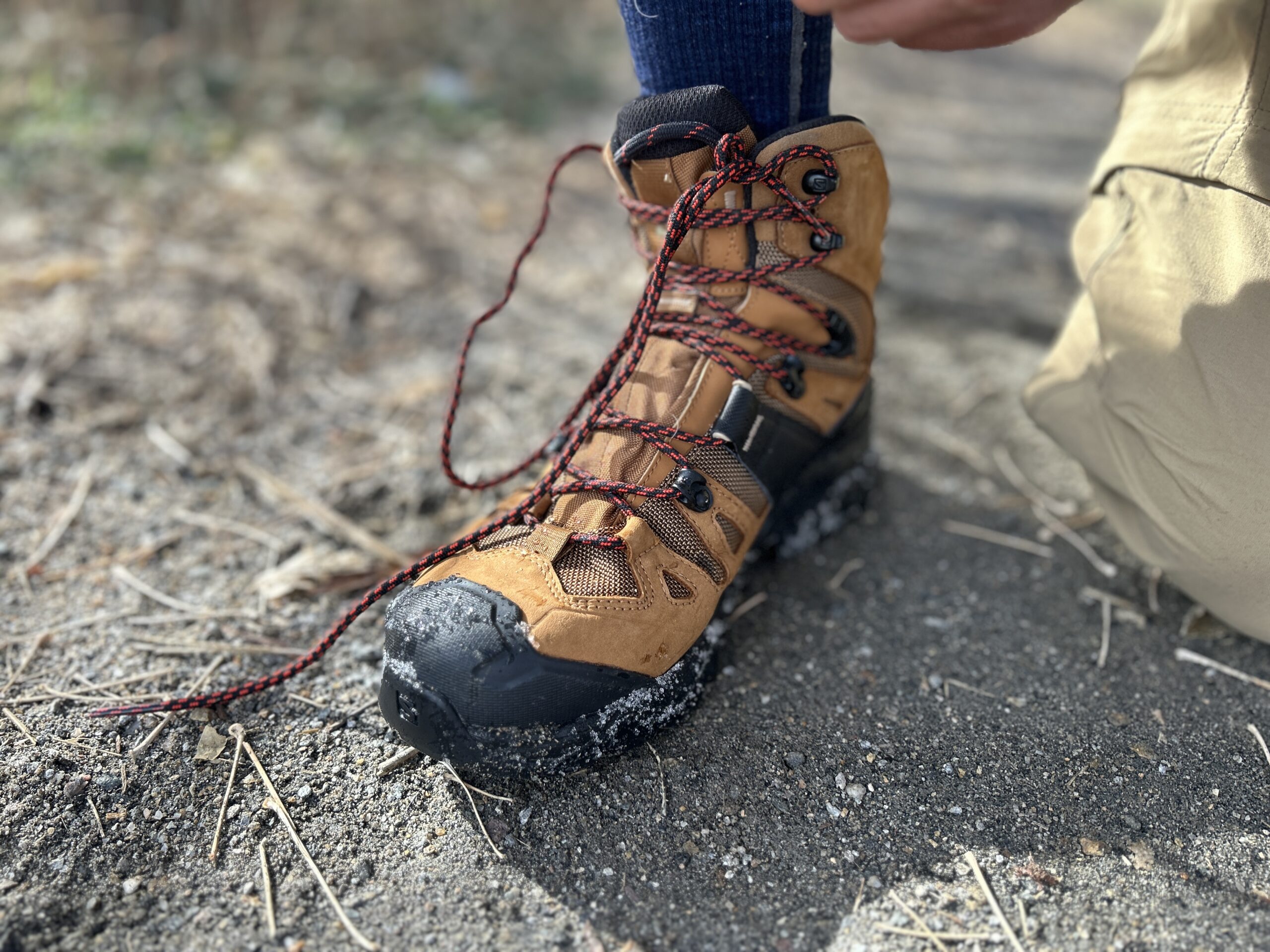 Close up of a person tying their boots.