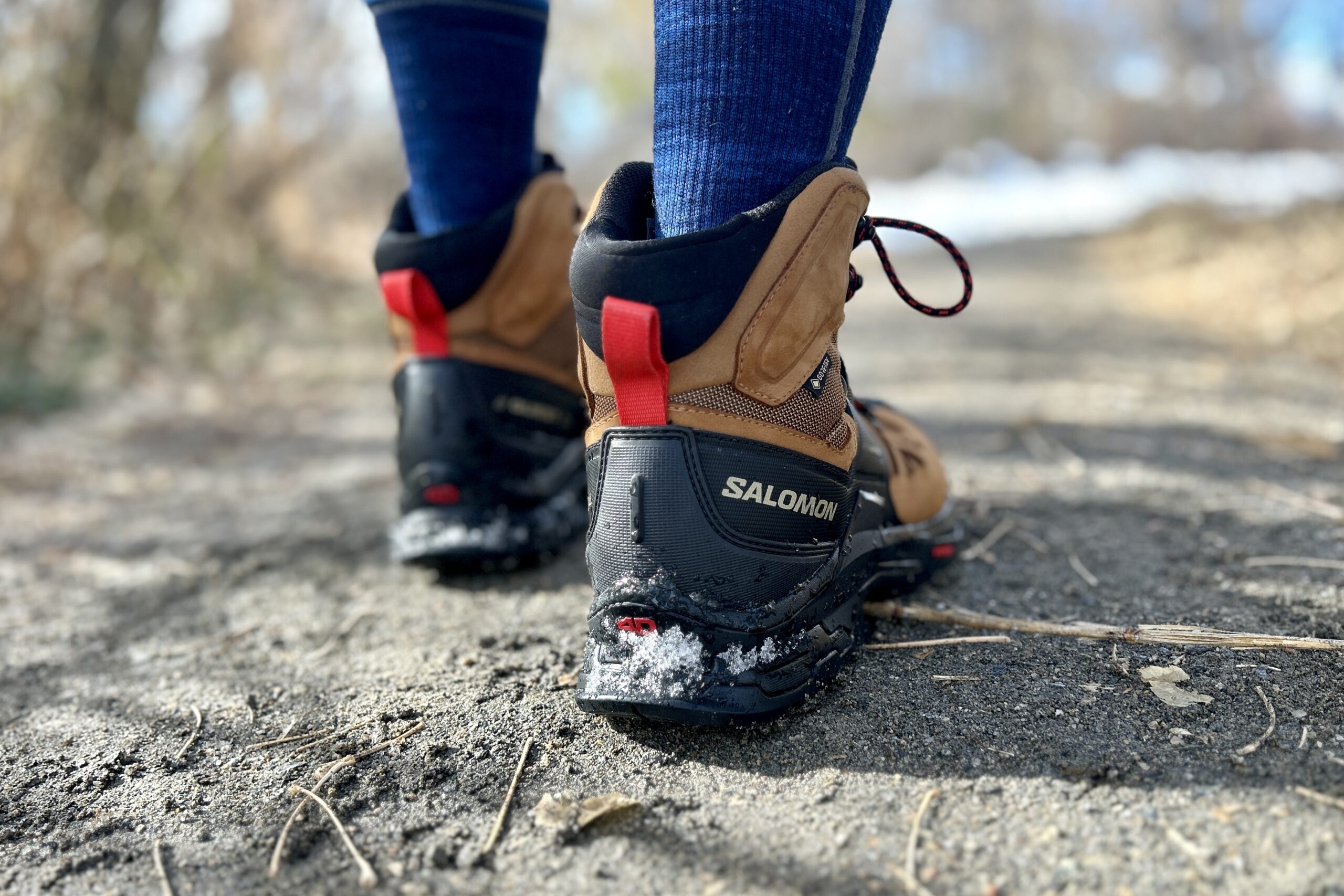 Close up picture of a pair of hiking boots from behind, showing the heel structure.