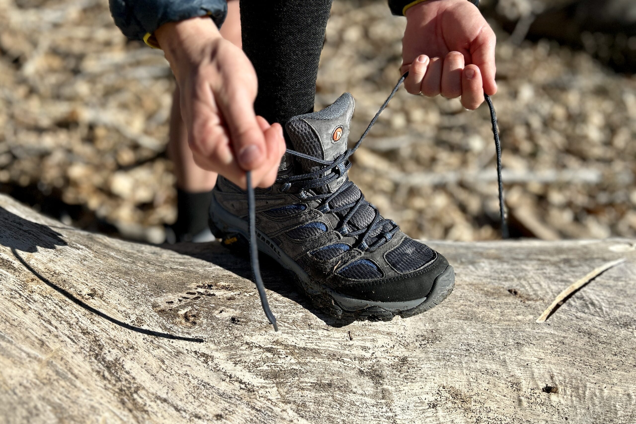 Close up of a person tying their boots.