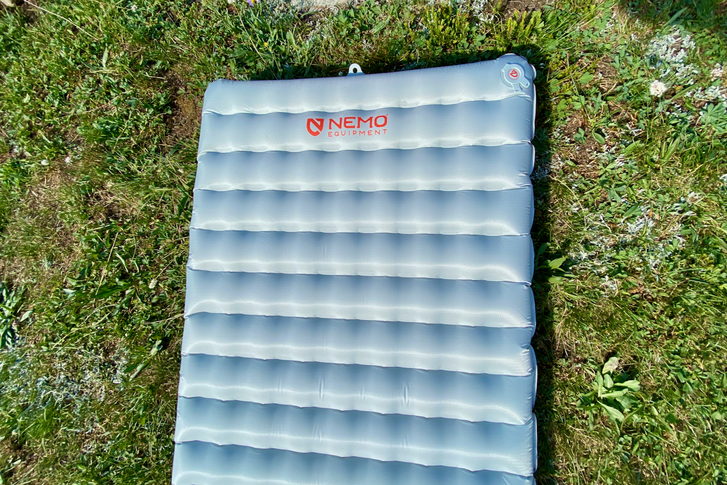 a top down view of the nemo all-season sleeping pad with the baffle and square-like grid pattern to keep the sleeper warm and insulated off the ground