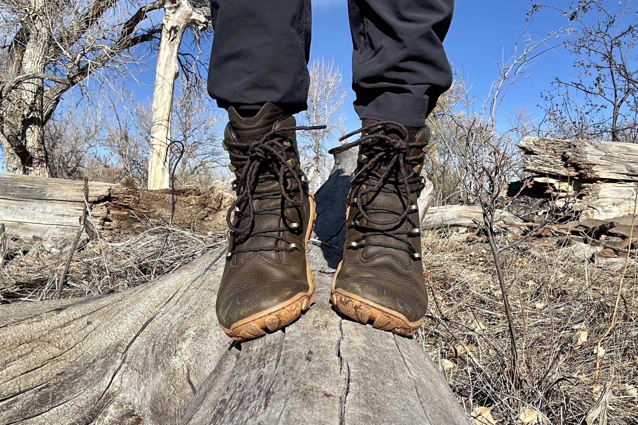 Close up image from knees down of a pair of boots from the front.