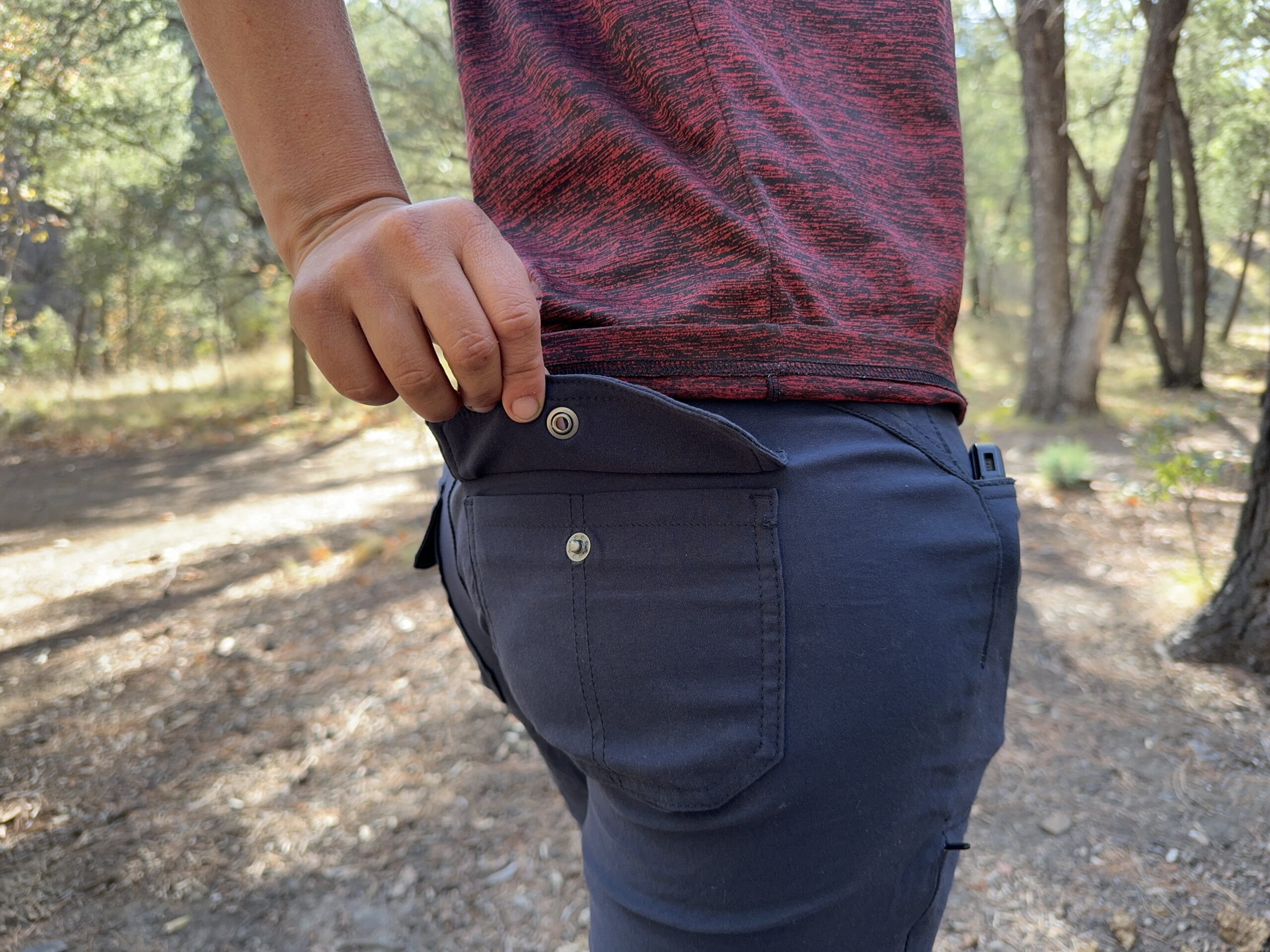 Close up of the envelope closure on the back pocket of the Halle pants.